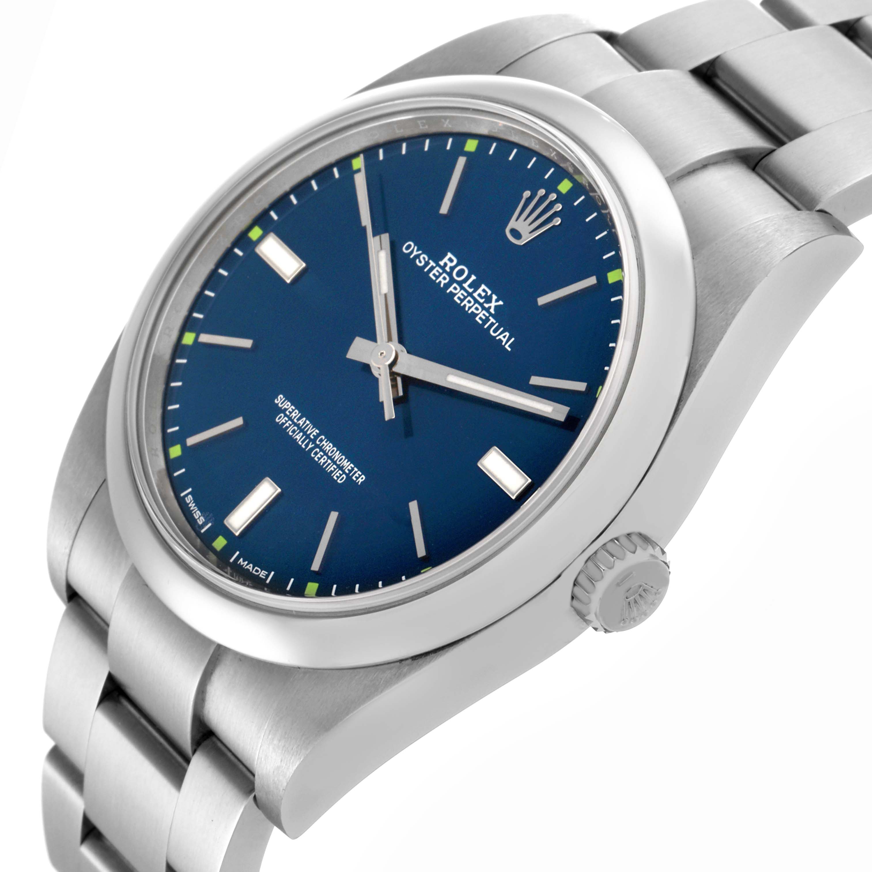 The Rolex Oyster Perpetual 114300 Men's Stainless Steel Blue Dial 114300 Men's Stainless Steel Blue Dial watch is shown at a three-quarter angle, displaying the blue dial, case, crown, and part of the bracelet.