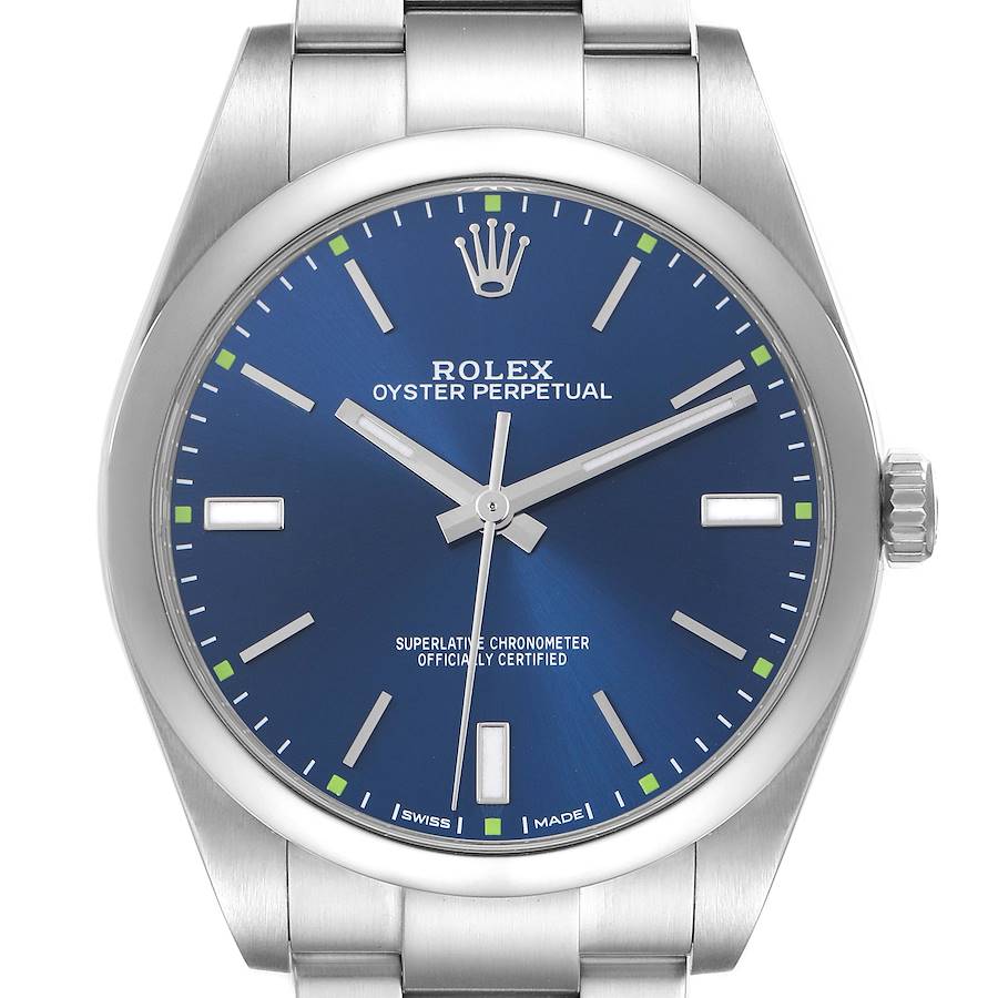 The image shows a front view of a Rolex Oyster Perpetual, highlighting the blue dial, markers, hands, and crown.