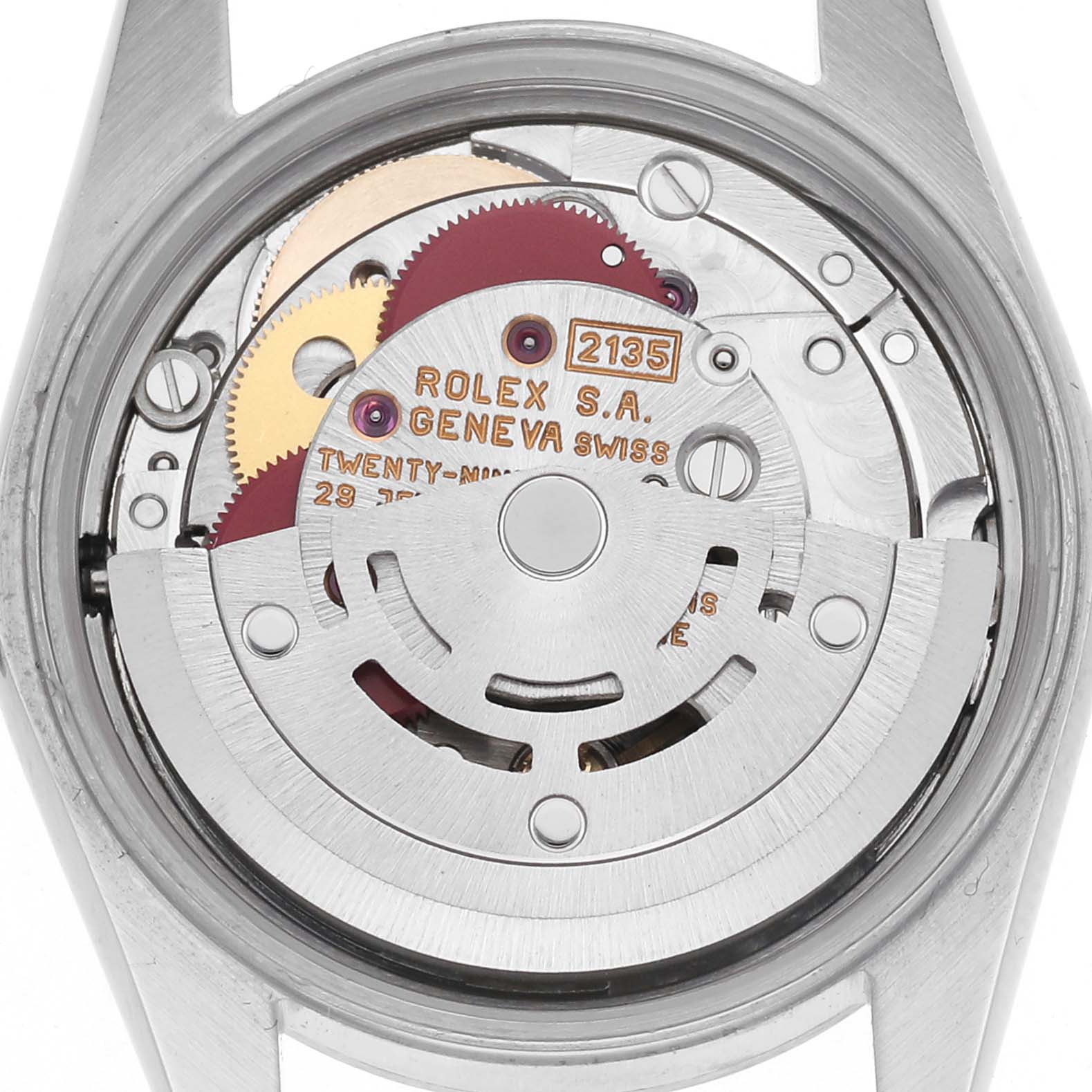 The image shows the movement of a Rolex Oyster Perpetual 67180 Women's Stainless Steel Pink Dial 67180 Women's Stainless Steel Pink Dial from the back, highlighting its gears and mechanical components.
