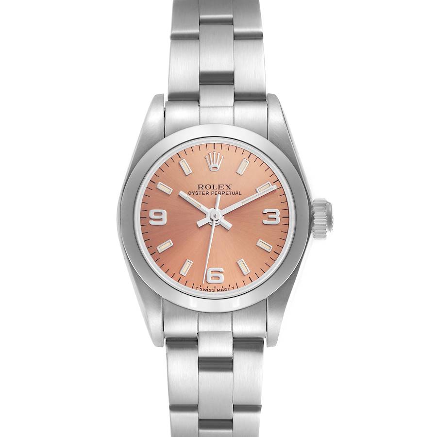 The Rolex Oyster Perpetual watch is shown from a top-down angle, displaying the dial, bezel, and metal bracelet.