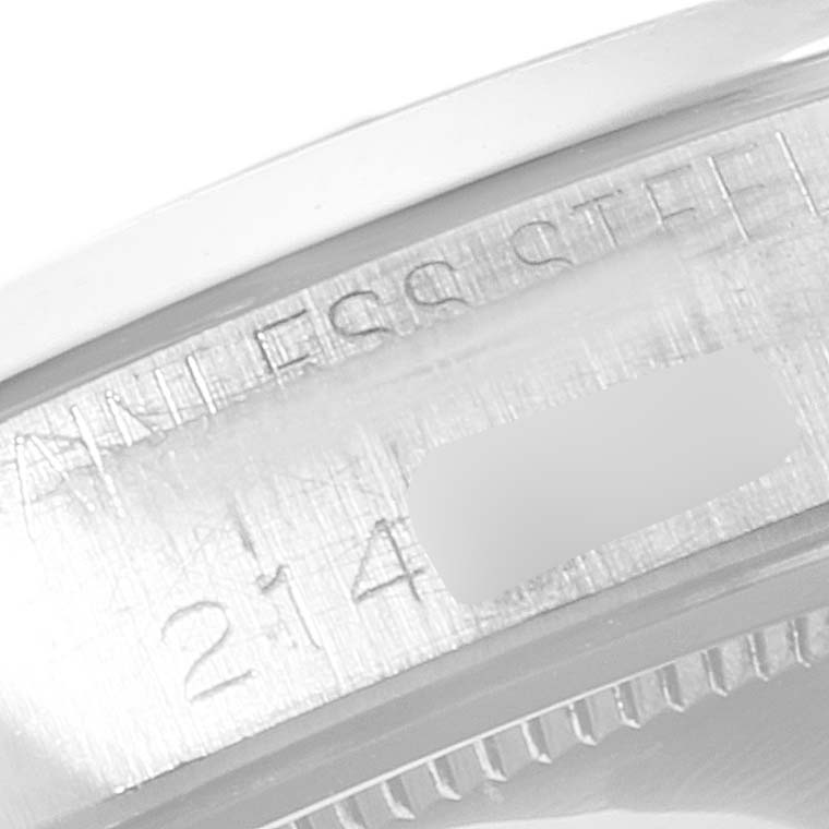 The image shows a close-up of the inside case edge with engraved details of a Rolex Vintage Collection 6694 Men
s Stainless Steel Silver Dial 6694 Men
s Stainless Steel Silver Dial model watch.