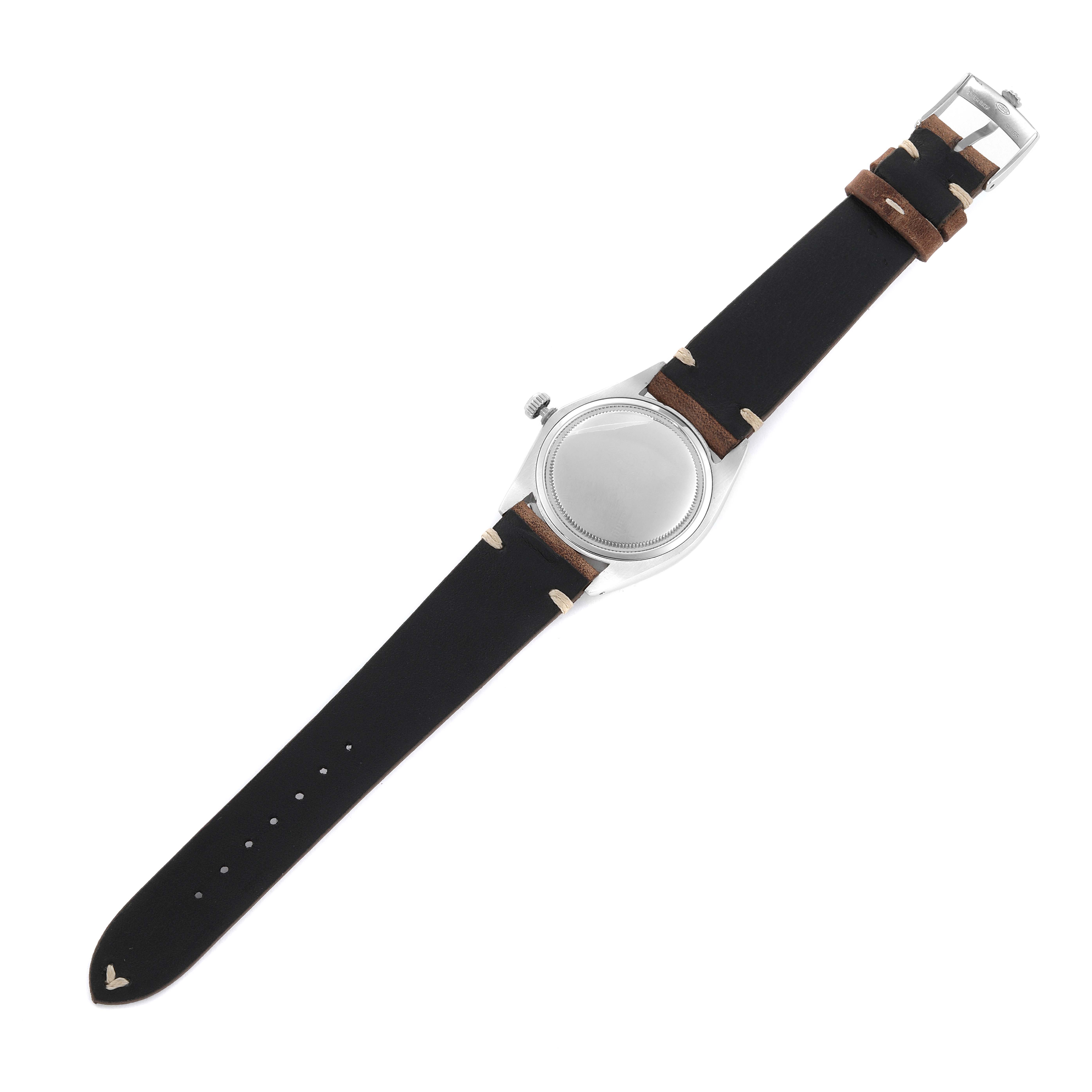 The Rolex Vintage Collection 6694 Men's Stainless Steel Silver Dial 6694 Men's Stainless Steel Silver Dial watch is shown from the back, featuring its leather strap and metal case.