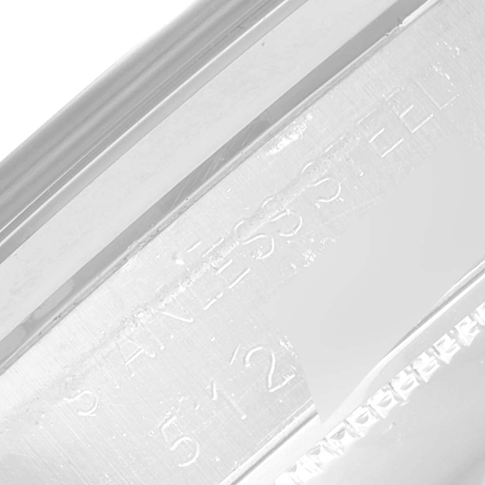 This close-up image shows the engraved case edge of a Rolex Vintage Collection 6694 Men's Stainless Steel Silver Dial 6694 Men's Stainless Steel Silver Dial watch, highlighting the "STAINLESS STEEL" inscription.