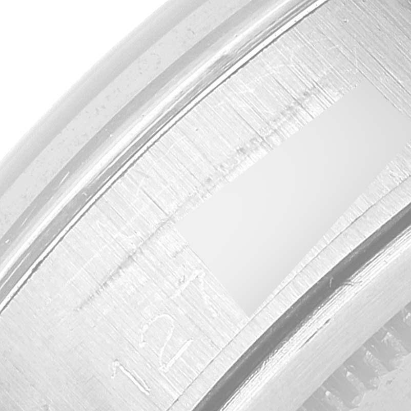 This image shows an extreme close-up of the outer edge of the watch case of the Rolex Vintage Collection 6694 Men's Stainless Steel Silver Dial 6694 Men's Stainless Steel Silver Dial model.