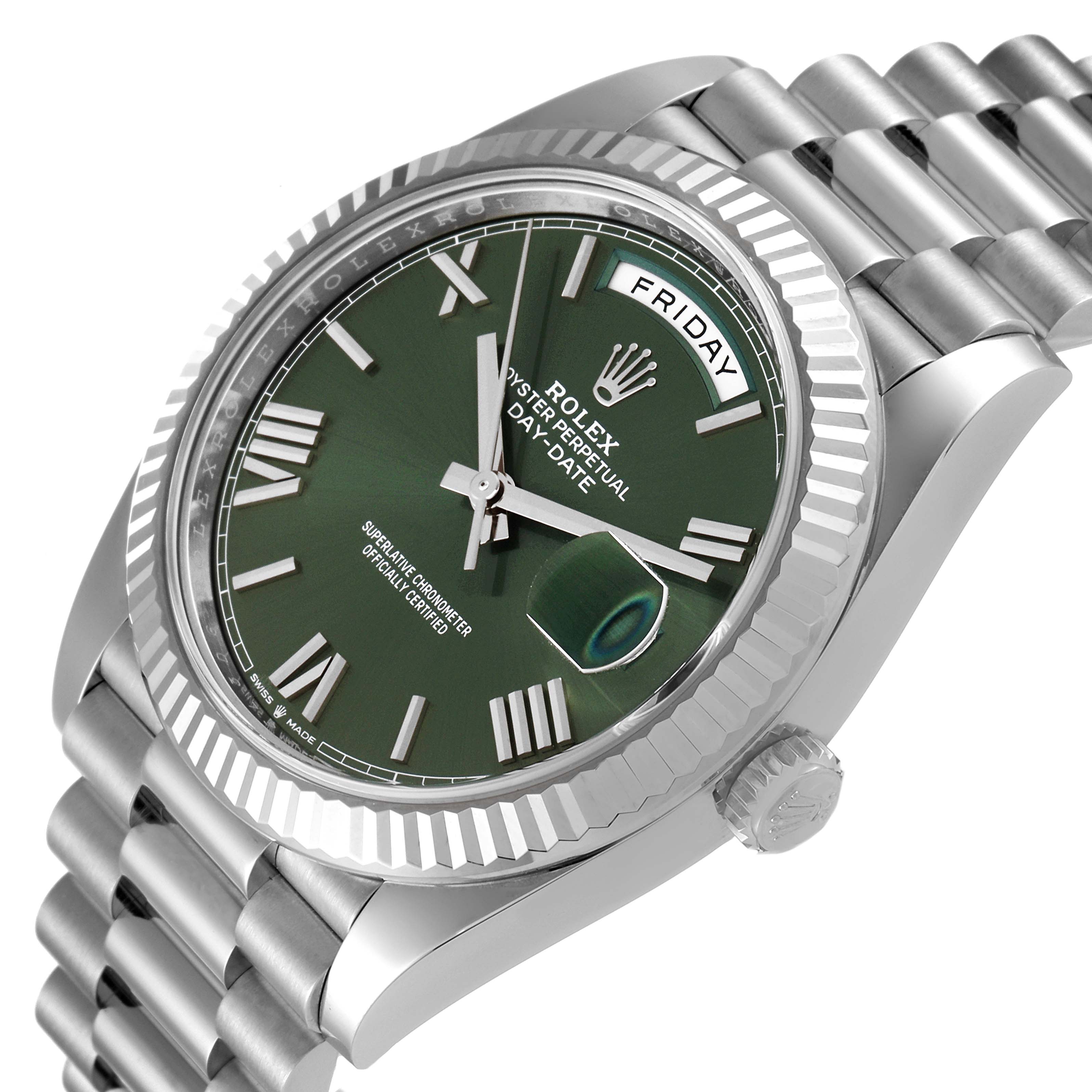 The Rolex President 228239 Men's White Gold Green Dial 228239 Men's White Gold Green Dial model watch is shown at a three-quarter angle, highlighting the green dial, fluted bezel, and bracelet.