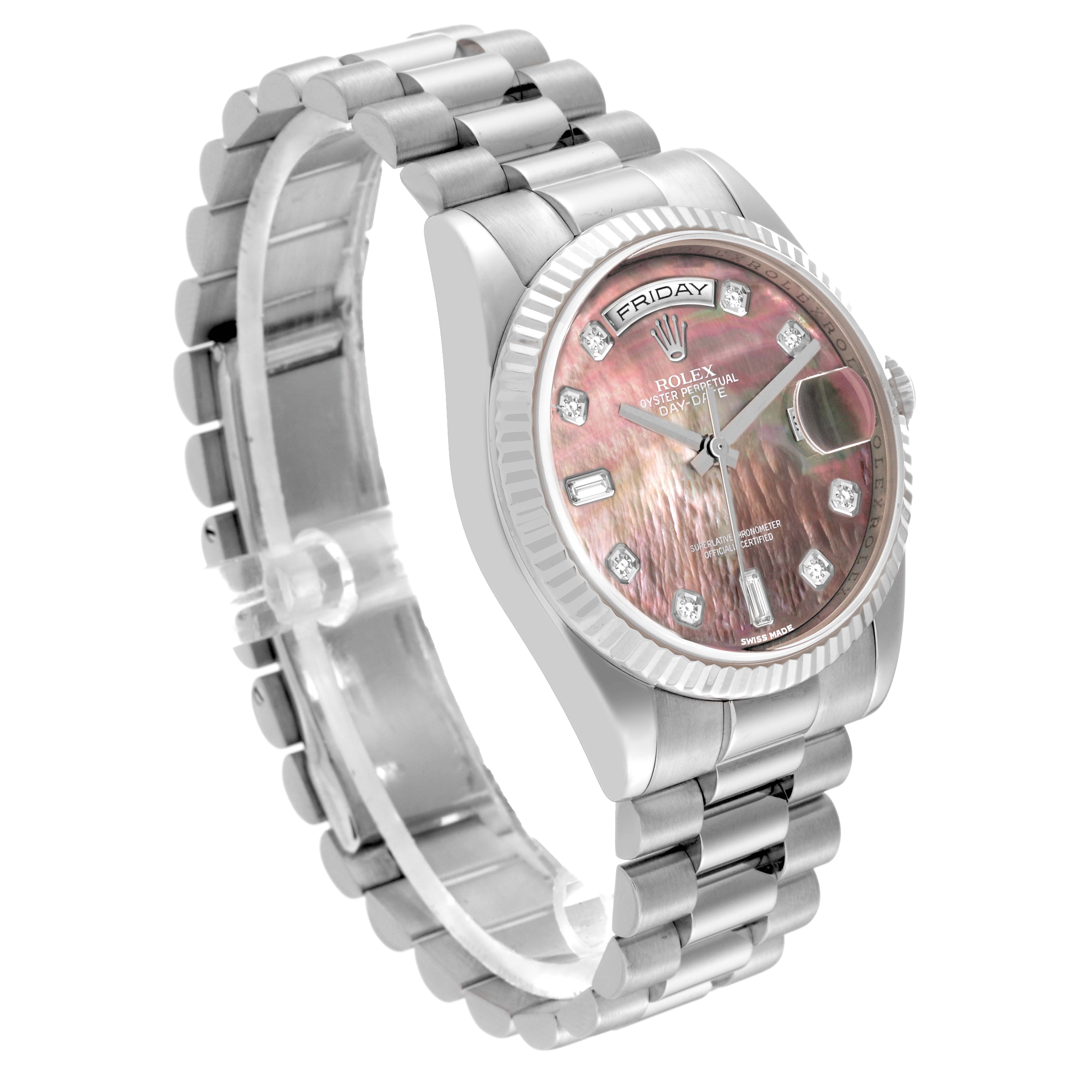 This image angles the Rolex President 118239 Men's White Gold Mother of Pearl Dial 118239 Men's White Gold Mother of Pearl Dial model, showing its bracelet, bezel, and face with a pink mother-of-pearl dial and day/date display.
