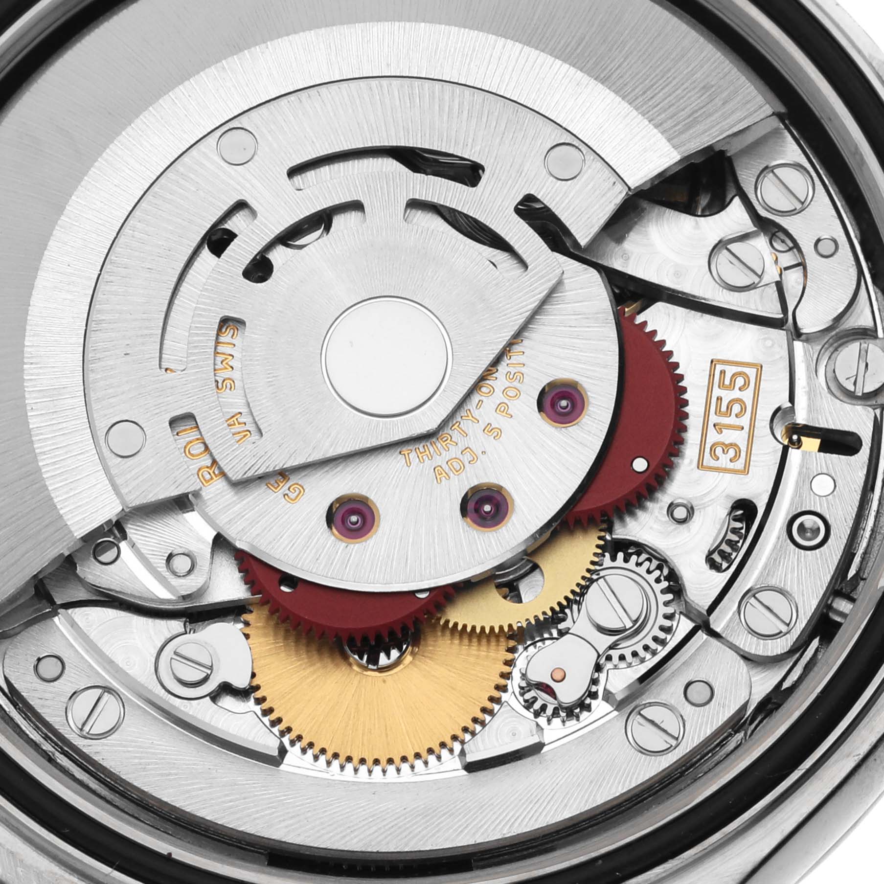 This close-up image shows the intricate inner mechanisms of a Rolex President 118239 Men's White Gold Mother of Pearl Dial 118239 Men's White Gold Mother of Pearl Dial model watch, highlighting gears and other components.