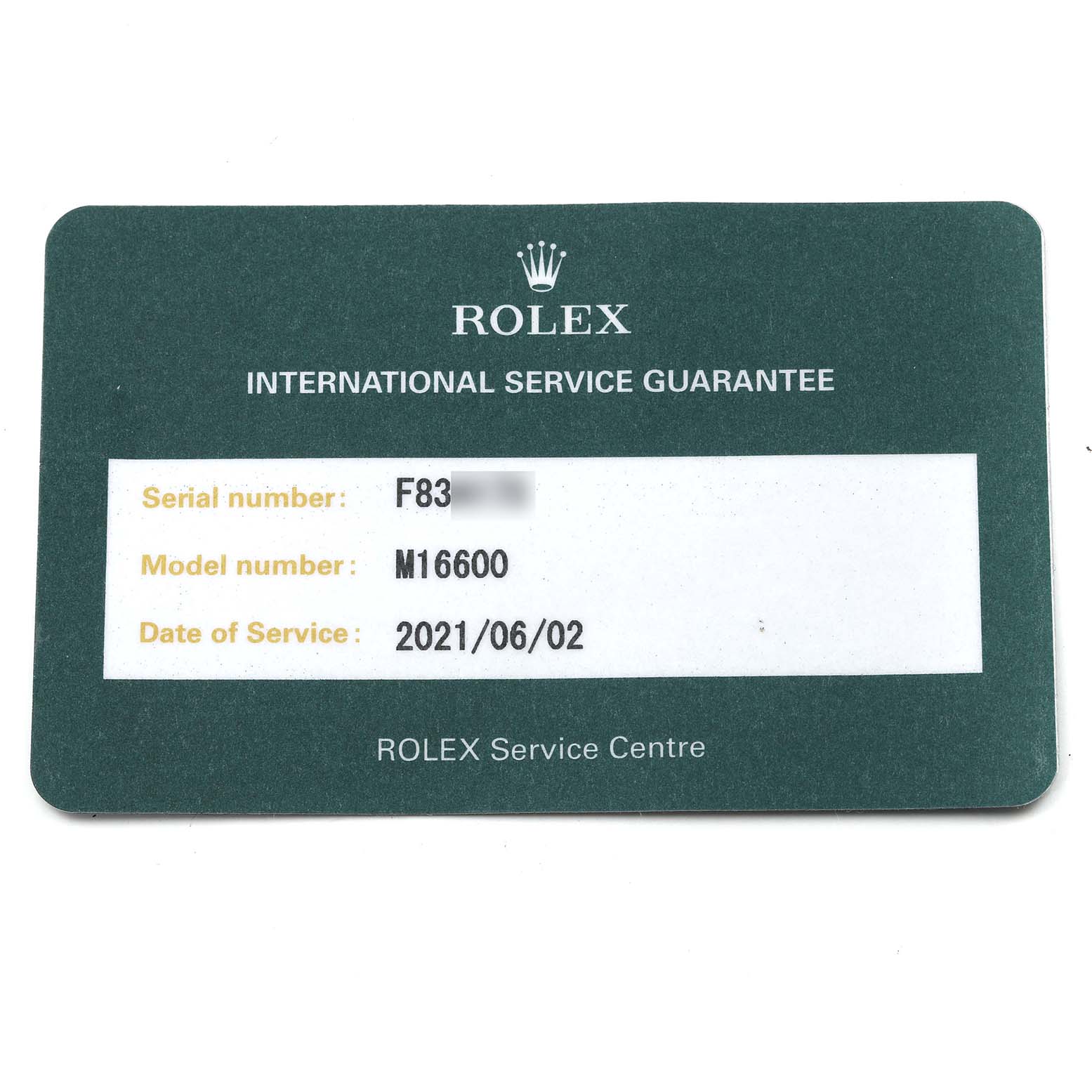 The image shows an International Service Guarantee card for the Rolex Sea-Dweller 16600 Men
s Stainless Steel Black Dial 16600 Men
s Stainless Steel Black Dial model M16600, laid flat.