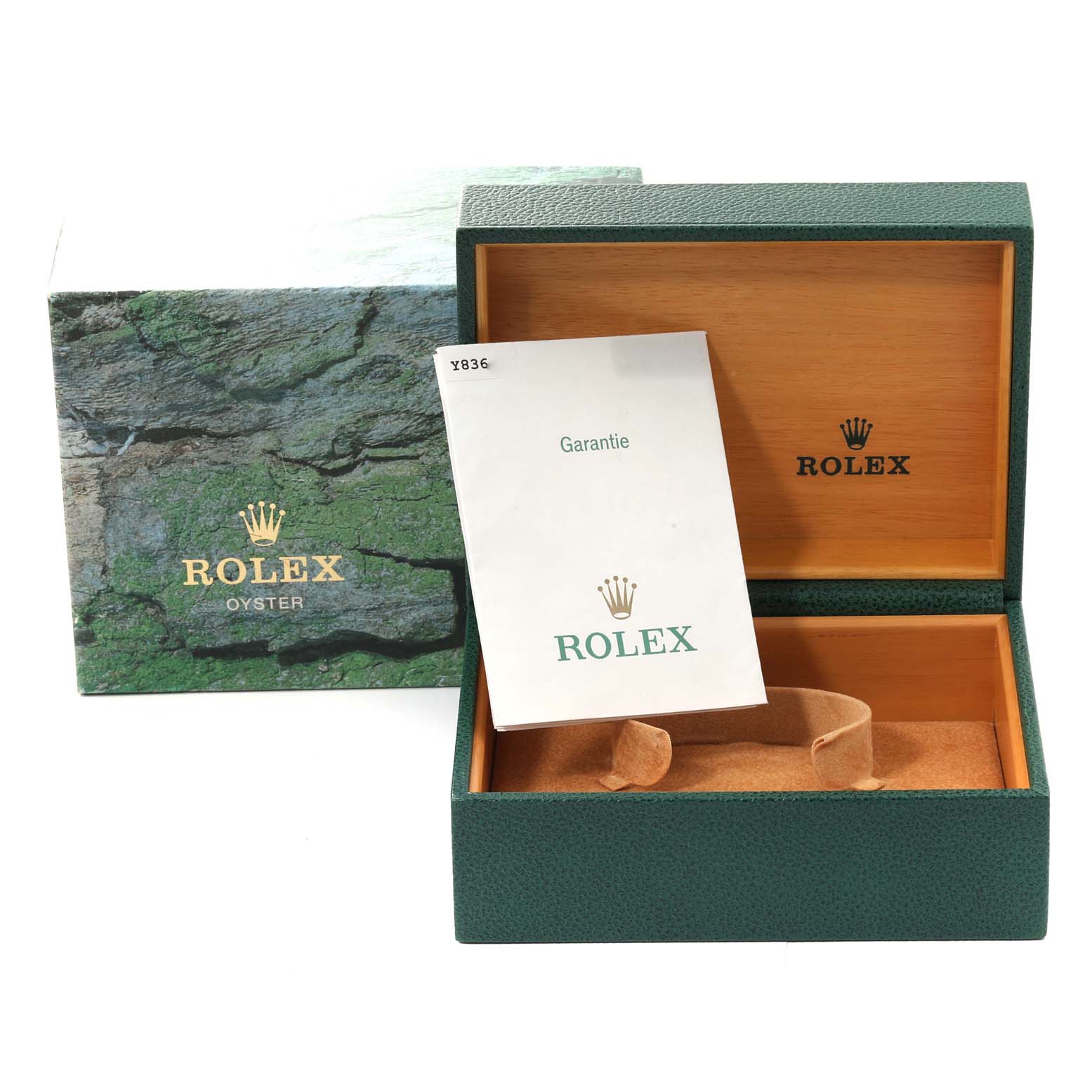 This image shows the open box and warranty booklet for a Rolex Submariner 14060 Men's Stainless Steel Black Dial 14060 Men's Stainless Steel Black Dial watch.