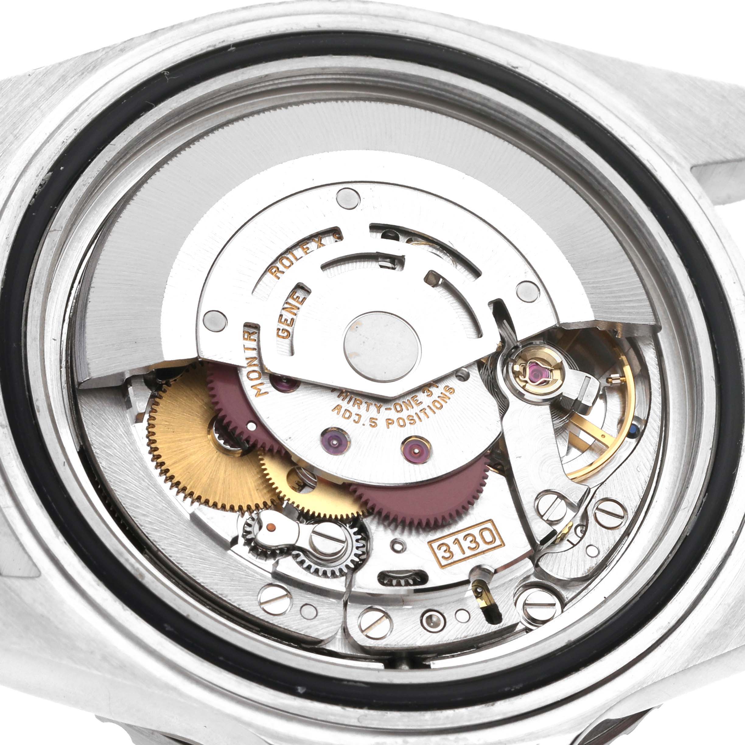 This is a close-up view of the internal movement of a Rolex Submariner 14060 Men's Stainless Steel Black Dial 14060 Men's Stainless Steel Black Dial watch, showing gears, screws, and other mechanisms.