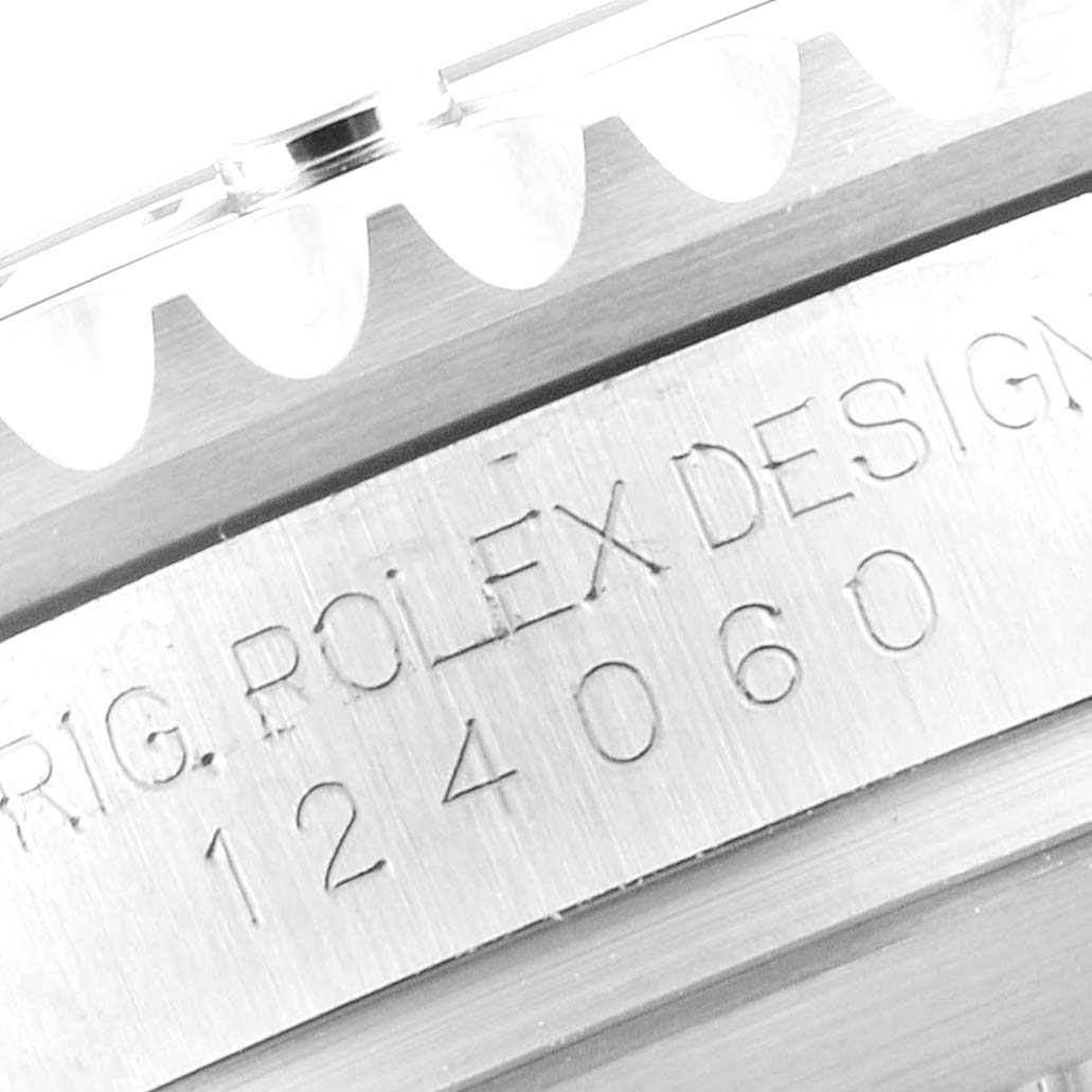 This close-up image shows the model number and part of the bezel of a Rolex Submariner 124060 Men
s Stainless Steel Black Dial 124060 Men
s Stainless Steel Black Dial watch.