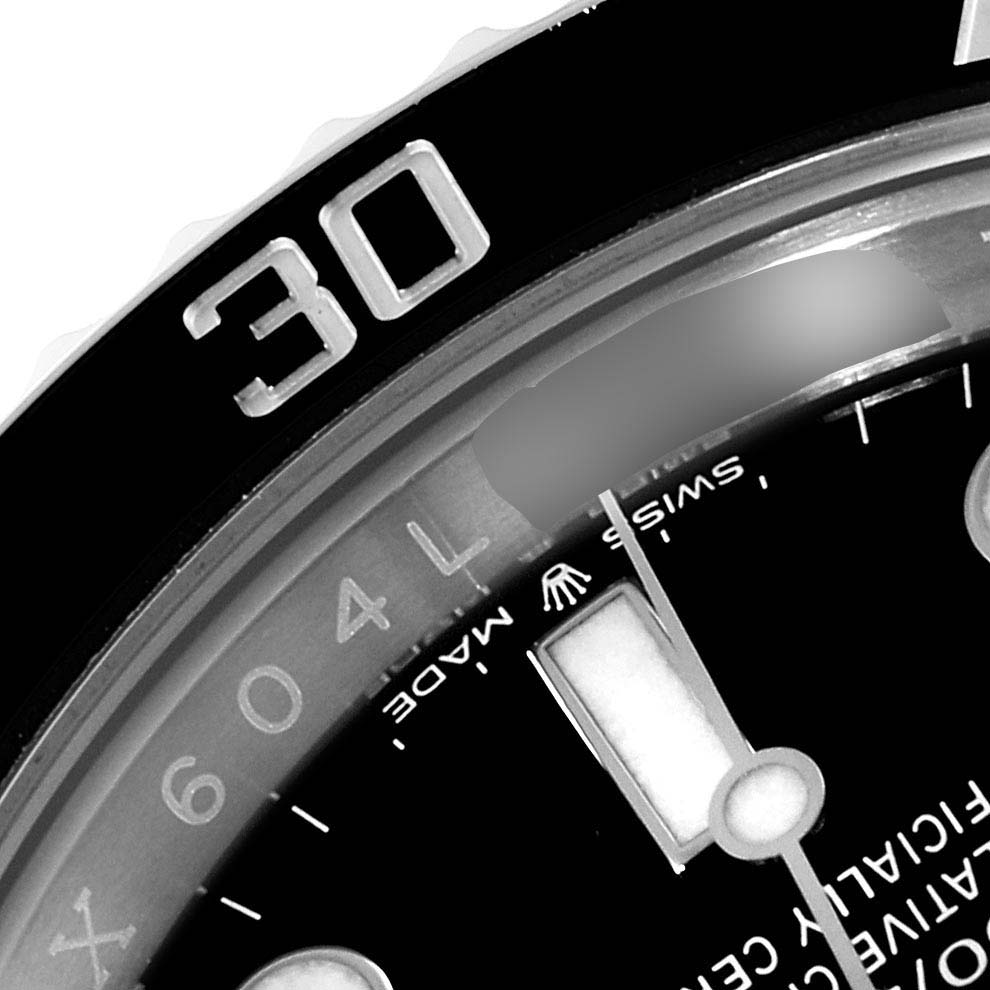 The image shows a close-up of the bezel and part of the dial of a Rolex Submariner 124060 Men
s Stainless Steel Black Dial 124060 Men
s Stainless Steel Black Dial watch.
