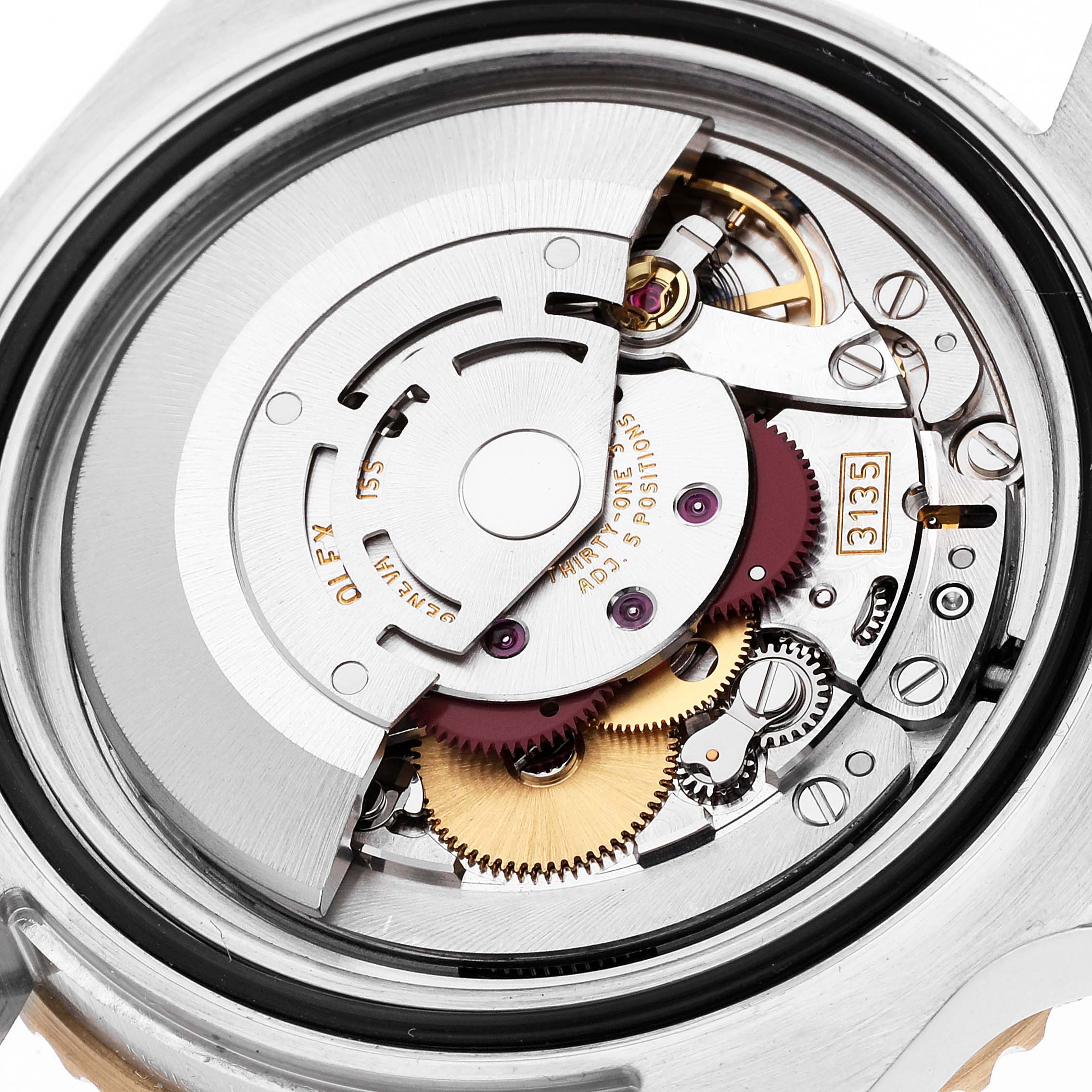 The image shows the intricate movement and internal mechanisms of a Rolex Submariner 116613 Men's Steel and Gold (two tone) Blue Dial 116613 Men's Steel and Gold (two tone) Blue Dial watch from a backside angle.