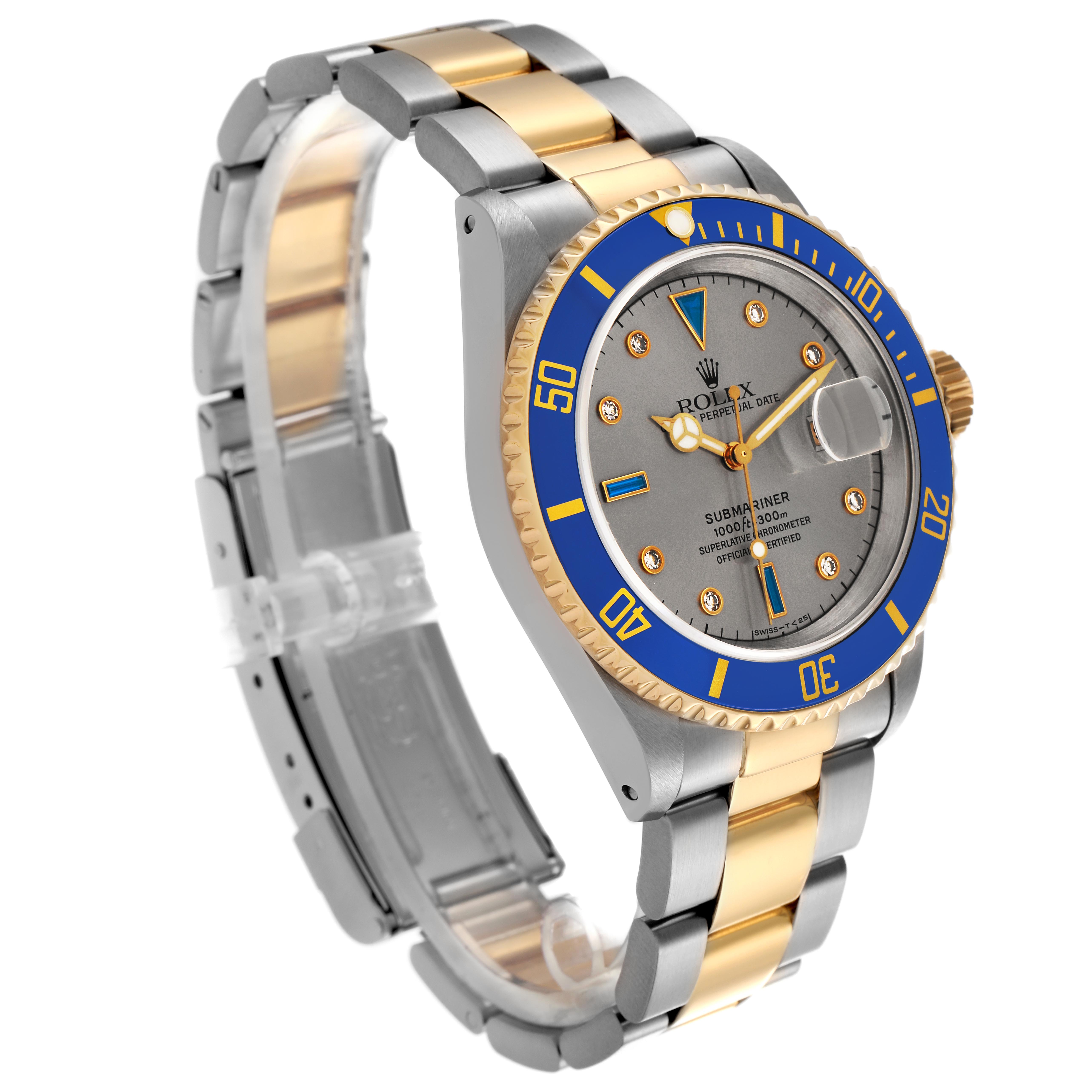 The Rolex Submariner 16613 Men's Steel and Gold (two tone) Silver Dial 16613 Men's Steel and Gold (two tone) Silver Dial watch is shown at a three-quarter angle, highlighting the bezel, dial, and two-tone bracelet.