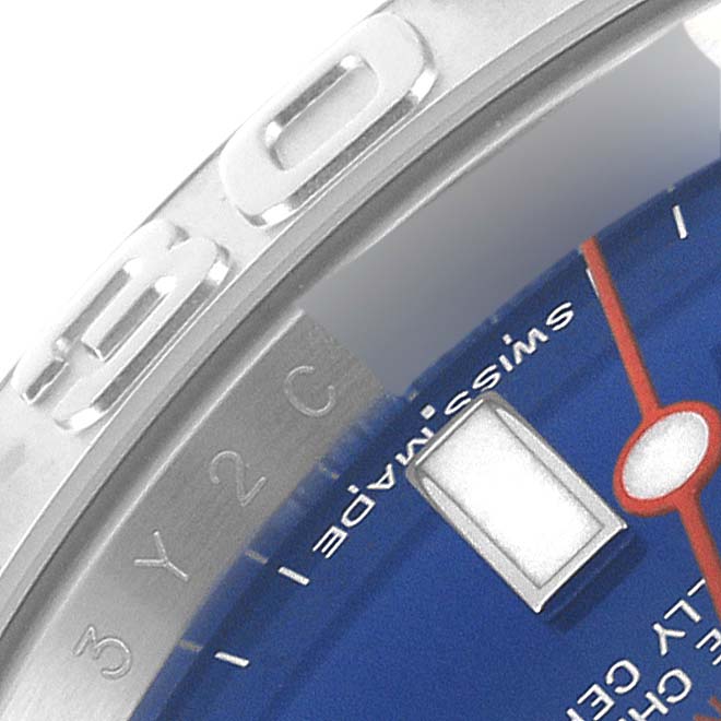 This close-up image of the Rolex Yacht-Master 116622 Men's Stainless Steel Blue Dial 116622 Men's Stainless Steel Blue Dial watch shows part of the bezel, dial, and a marker.