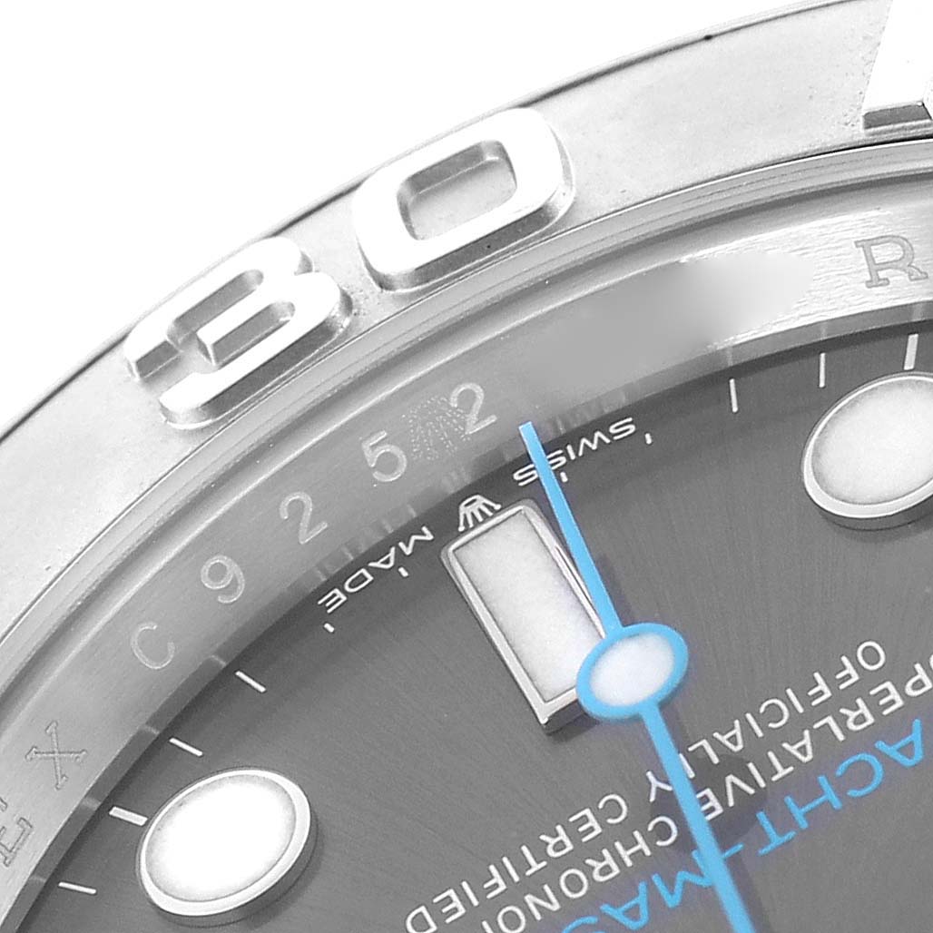 The image shows a close-up of the Rolex Yacht-Master 126622 Men's Stainless Steel Grey Dial 126622 Men's Stainless Steel Grey Dial watch face, highlighting the bezel, numeral "30," part of the dial, and the blue hand.
