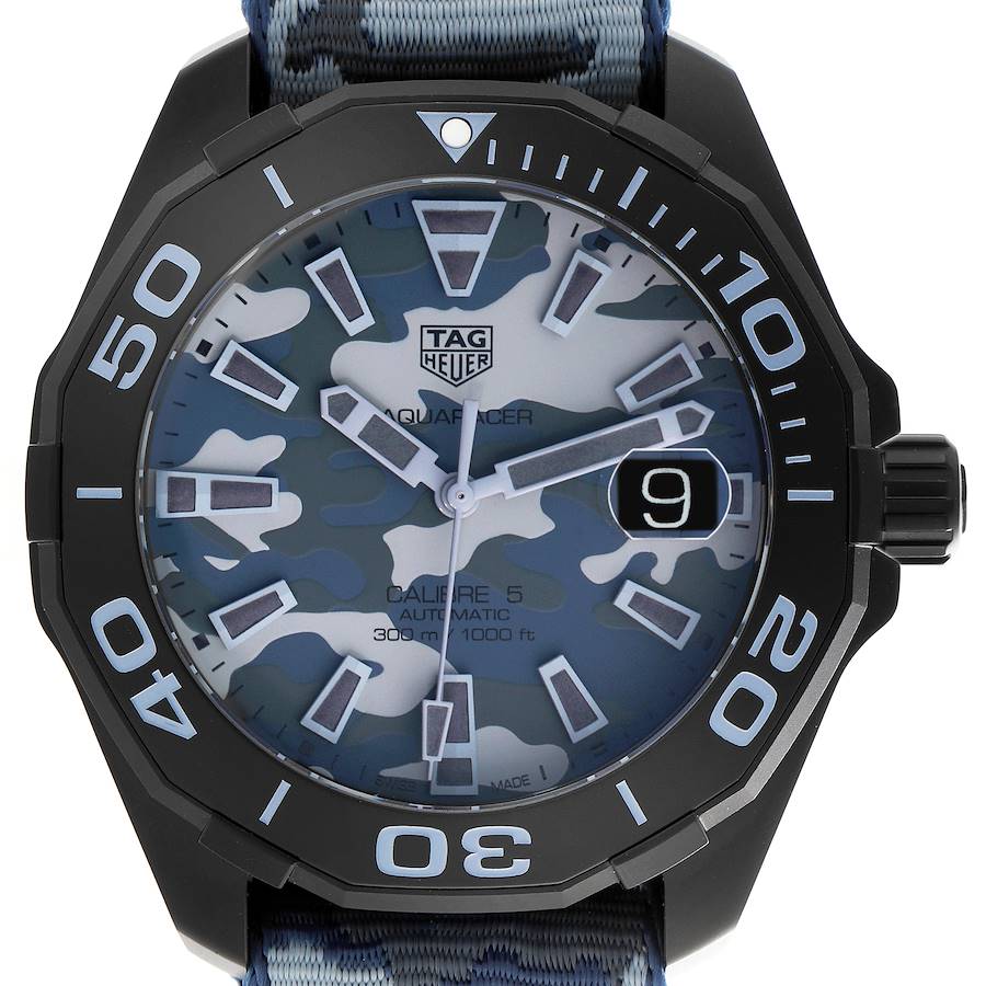 The image shows the Tag Heuer Aquaracer watch face straight on, with a camouflage dial, bezel, and a date window.