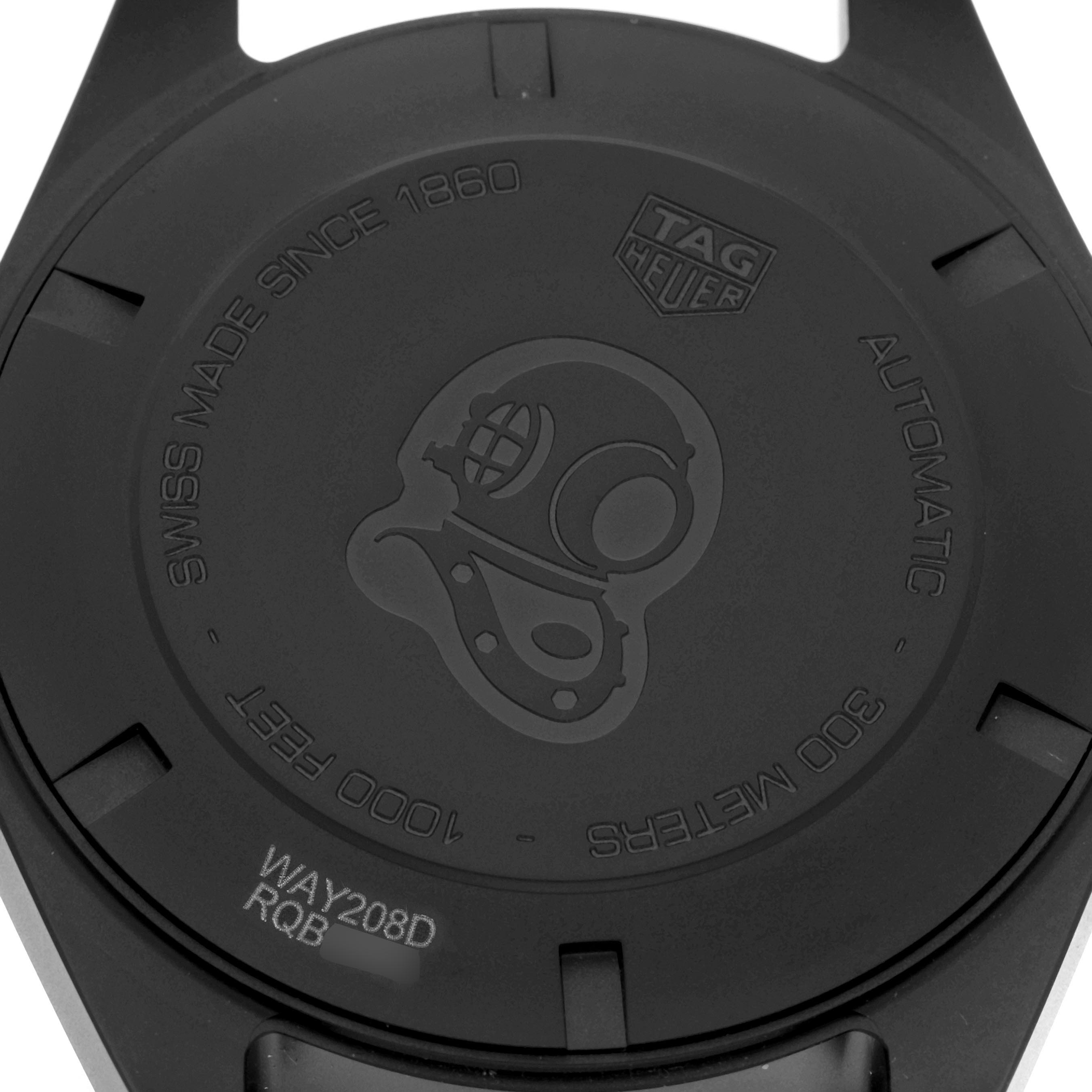 The image shows the back case of the Tag Heuer Aquaracer WAY208D.FC8221 Men
s Titanium Blue Dial WAY208D.FC8221 Men
s Titanium Blue Dial watch, featuring an engraved diver
s helmet design and branding.