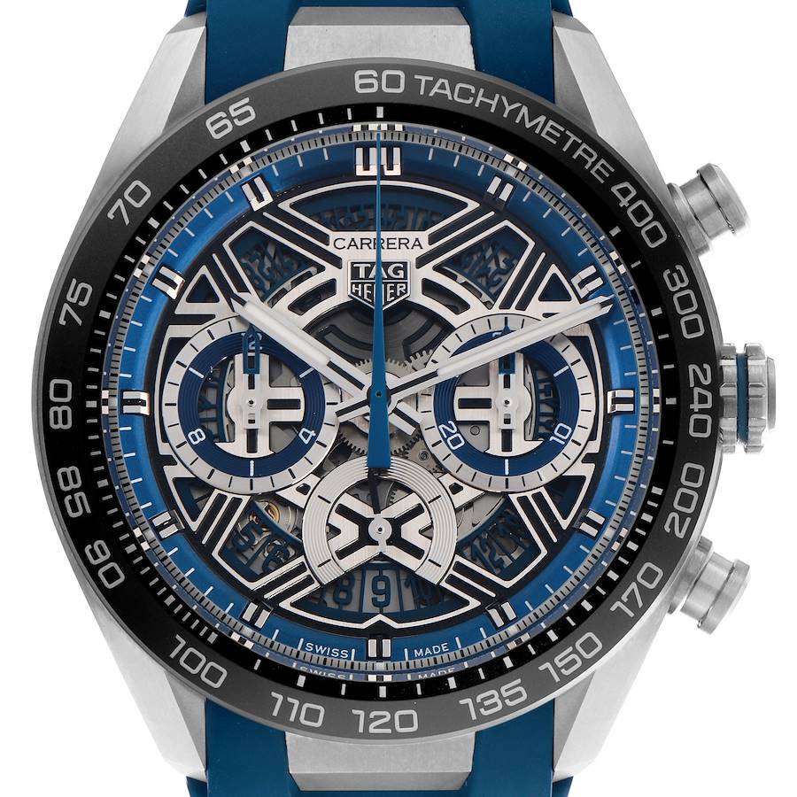 The Tag Heuer Carrera watch is shown from the front, displaying its intricate dial, tachymetre, and side pushers.