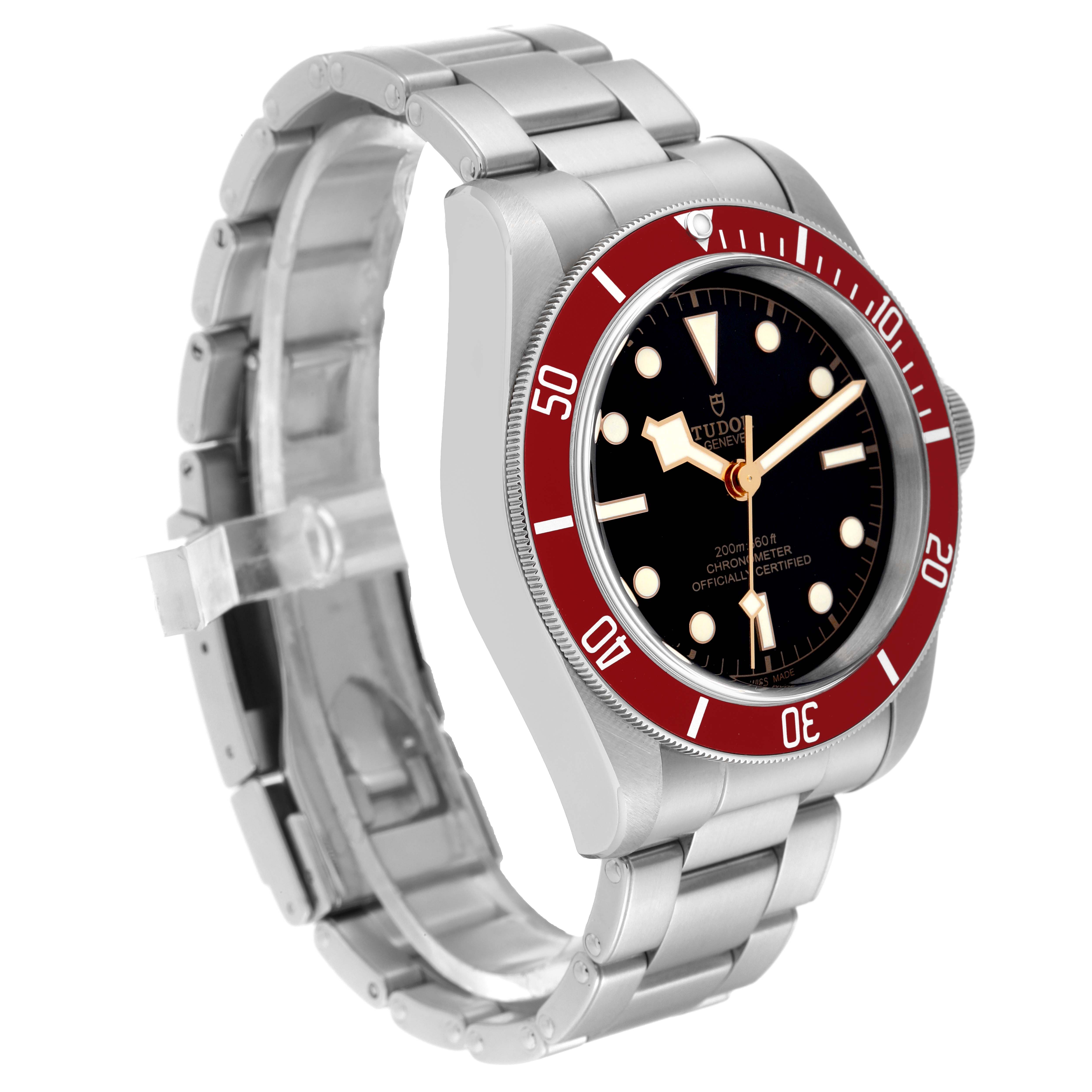 The image shows a side angle of the Tudor Heritage Black Bay 79230R Men
s Stainless Steel Black Dial 79230R Men
s Stainless Steel Black Dial watch with a red bezel, black dial, and stainless steel bracelet.