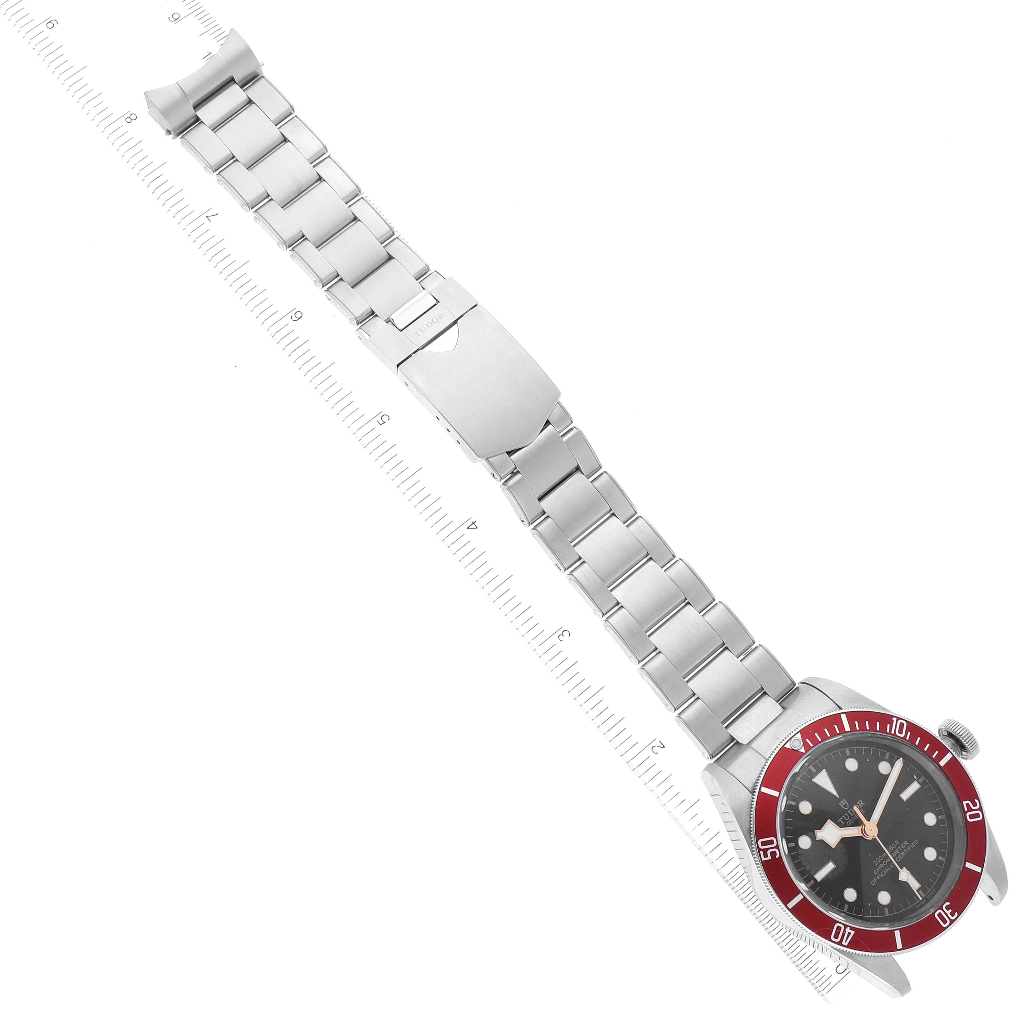 The image shows a top view of a Tudor Heritage Black Bay 79230R Men
s Stainless Steel Black Dial 79230R Men
s Stainless Steel Black Dial watch, highlighting its entire metallic bracelet and bezel.