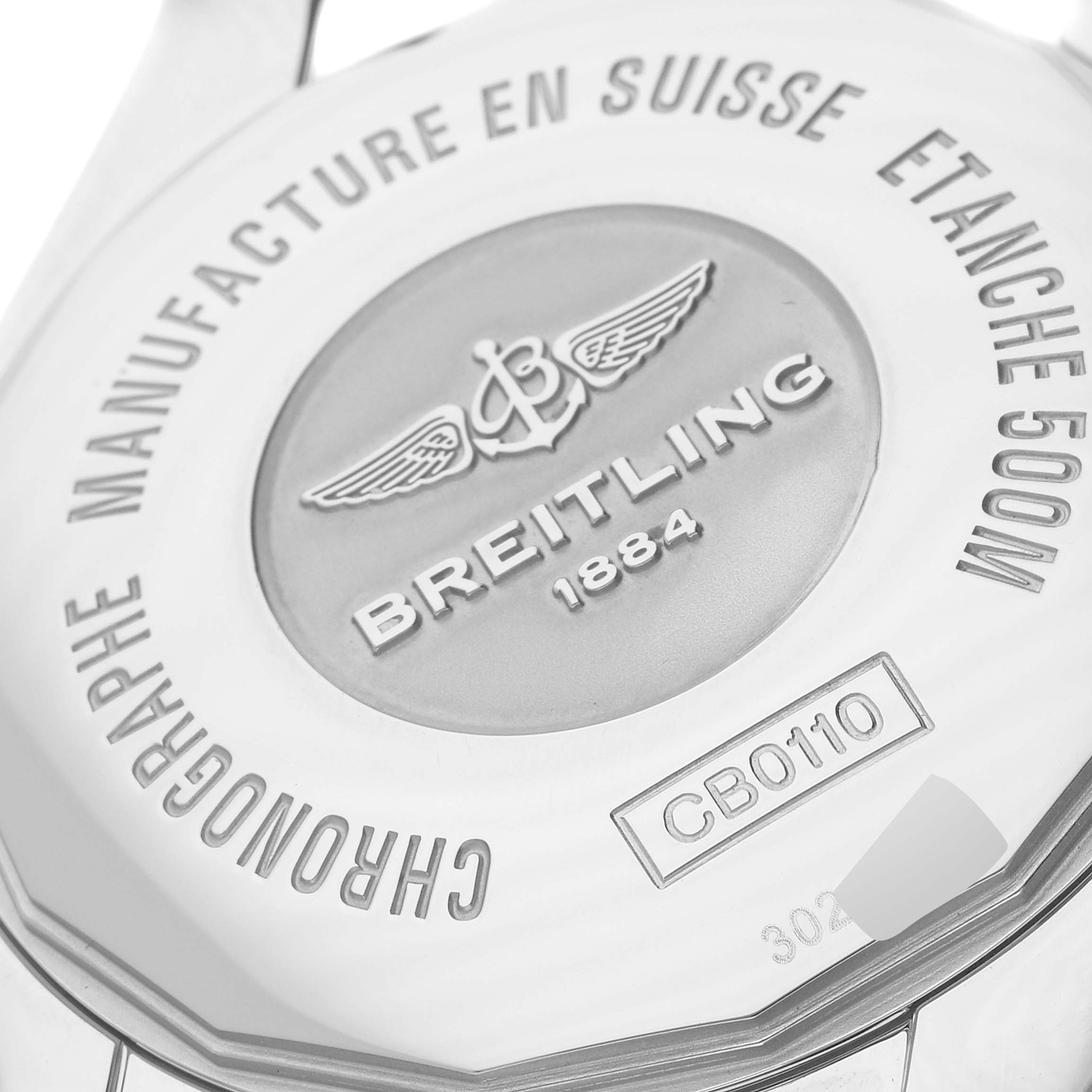 The image shows the back case of a Breitling Chronomat CB0110 Men's Steel and Gold (two tone) Brown Dial CB0110 Men's Steel and Gold (two tone) Brown Dial model watch, highlighting the brand's engraving and water resistance information.