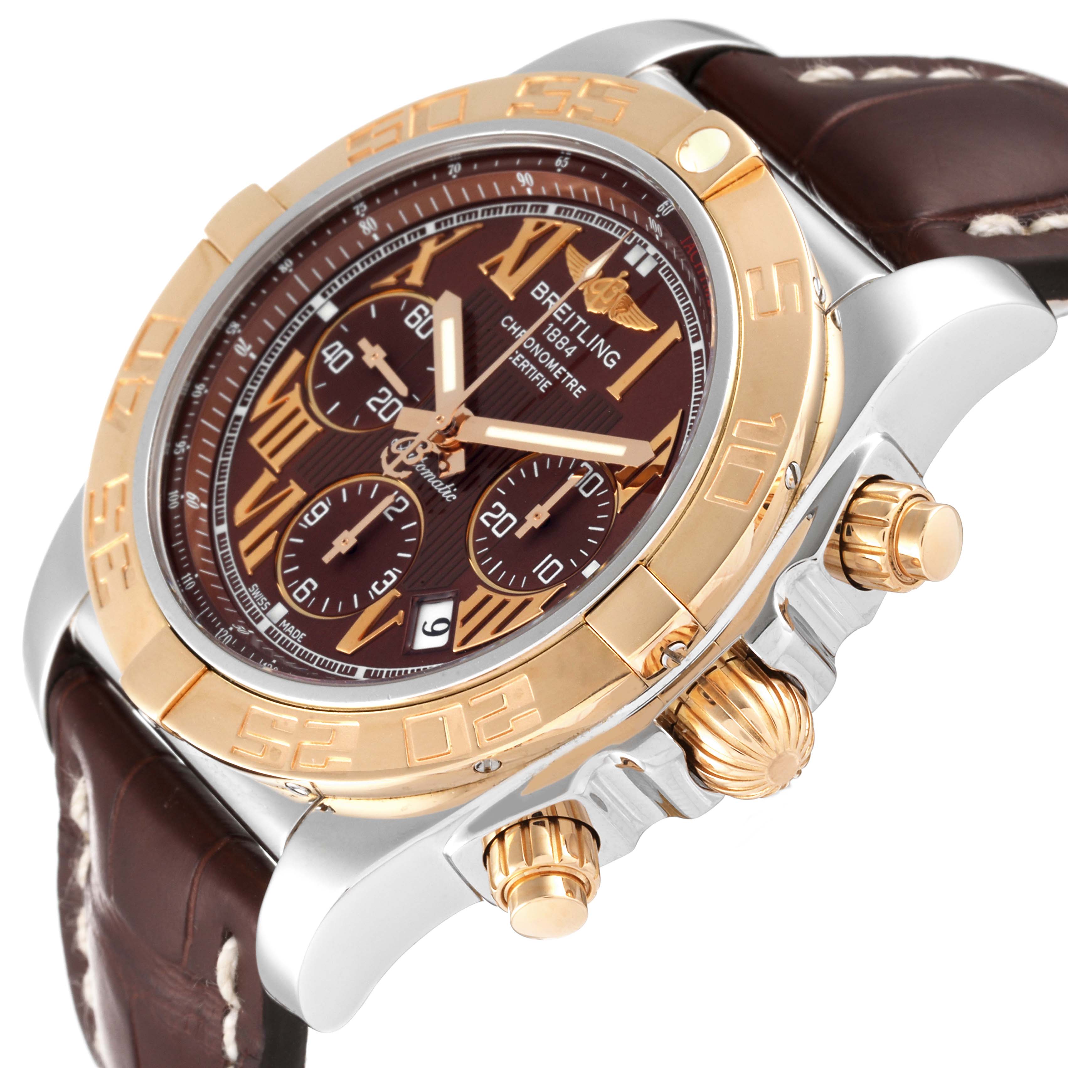 The image shows a Breitling Chronomat CB0110 Men's Steel and Gold (two tone) Brown Dial CB0110 Men's Steel and Gold (two tone) Brown Dial watch from an angled close-up, highlighting its face, bezel, pushers, and crown.