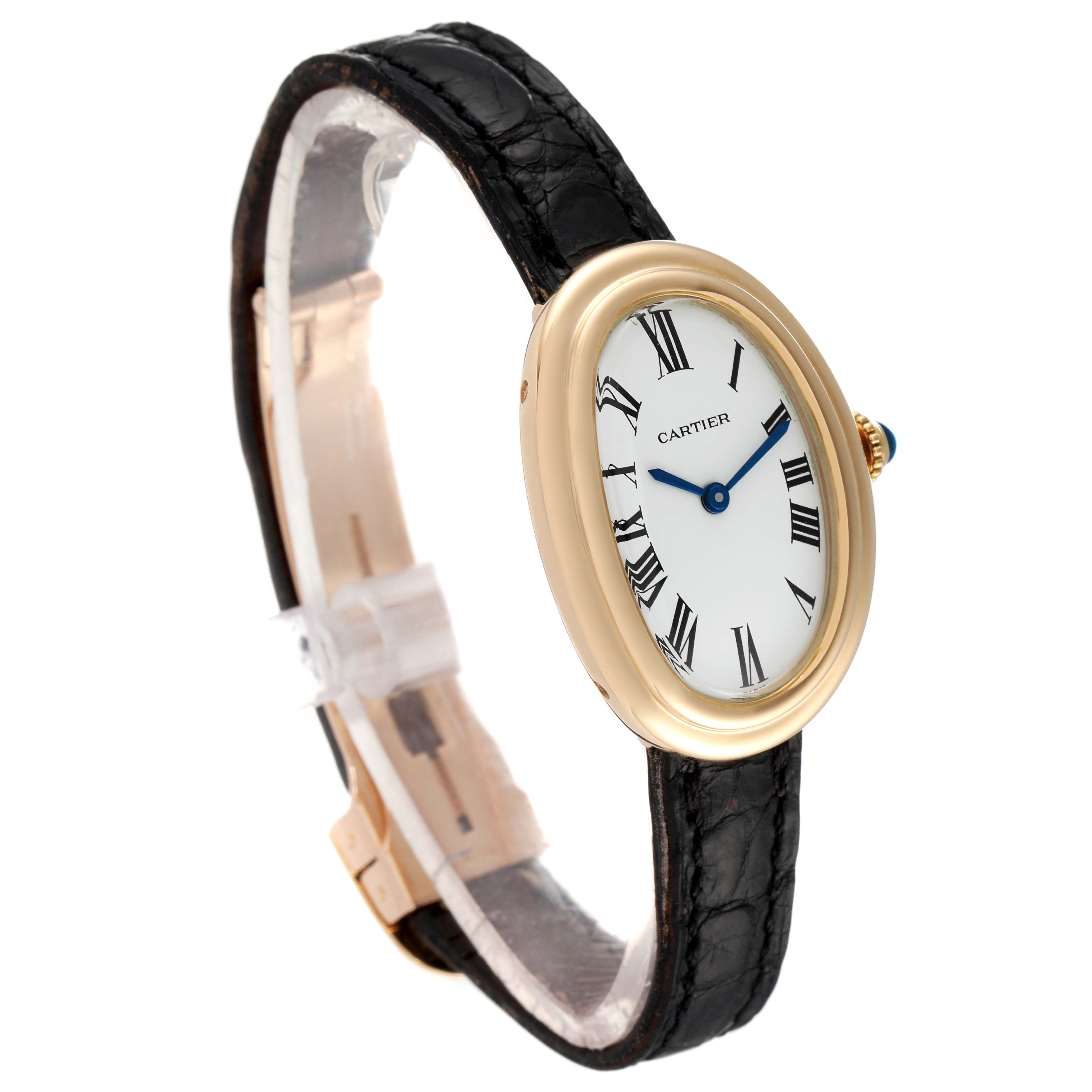 The image shows a side-front angle of the Cartier Baignoire Women's Yellow Gold White Dial Women's Yellow Gold White Dial watch with a black leather strap, white dial, and gold casing.