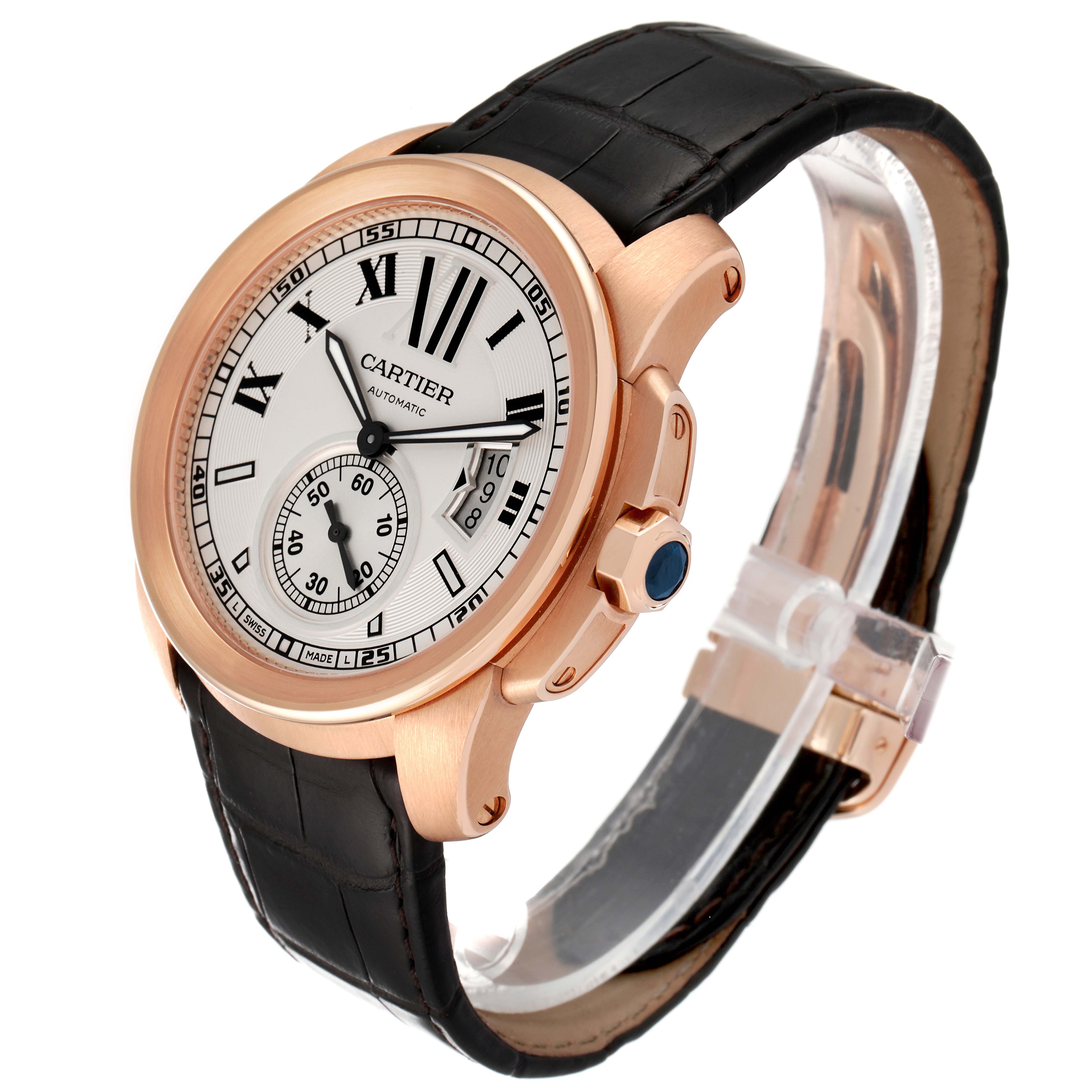 The image shows a Calibre de Cartier watch by Cartier at an angled side view, highlighting its dial and leather strap.