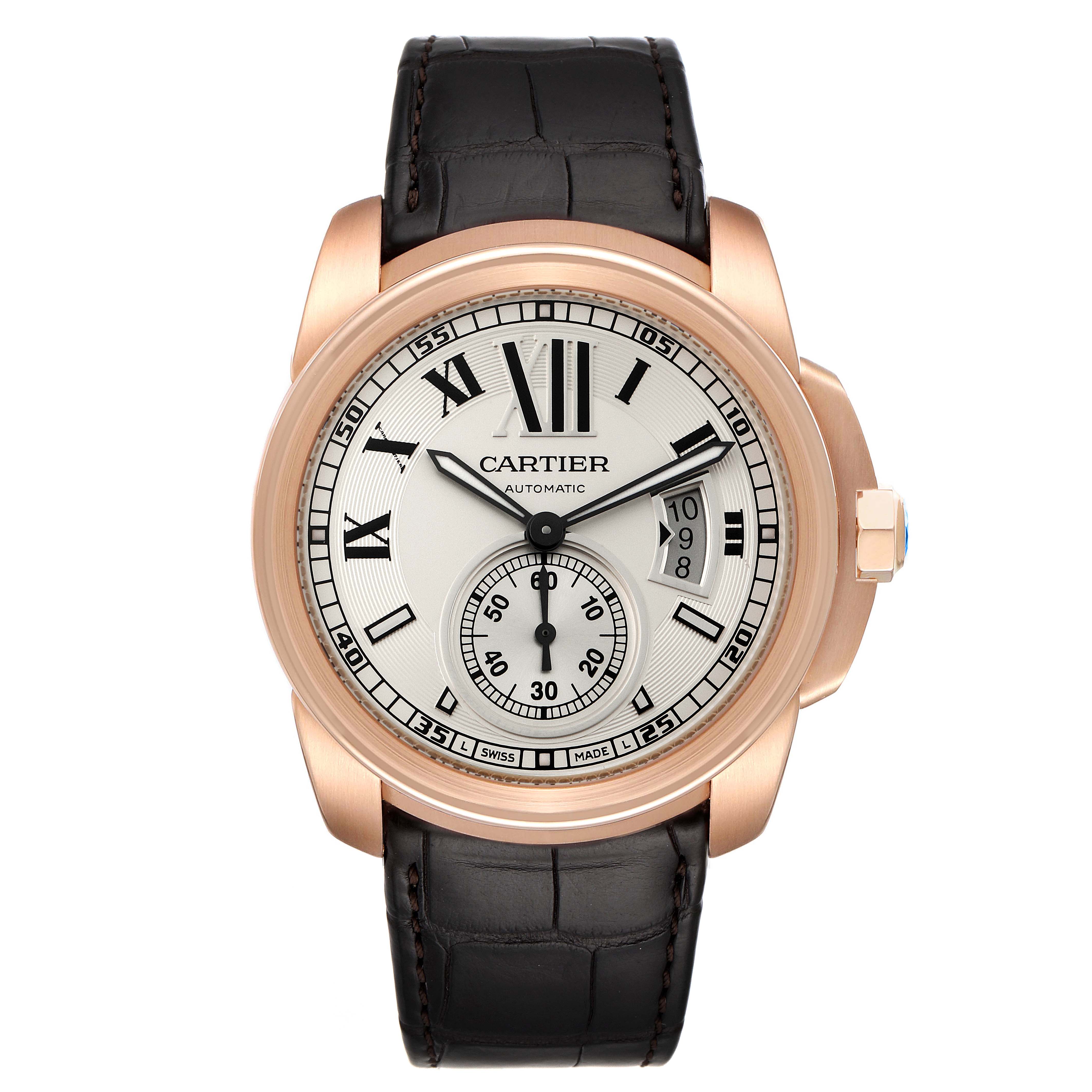 This image shows a front view of the Calibre de Cartier watch by Cartier, highlighting the dial, hands, and leather strap.