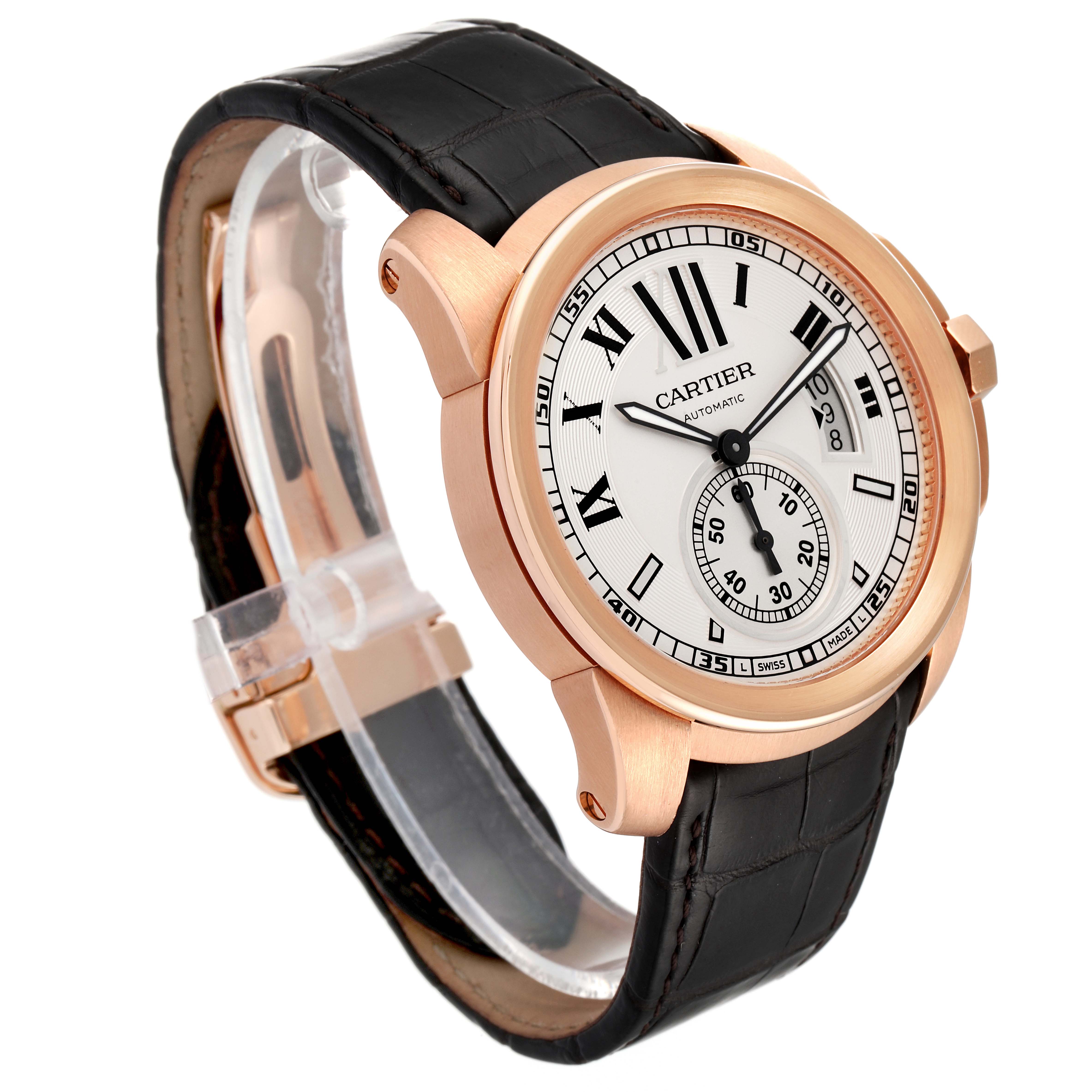 The image shows a Calibre de Cartier watch by Cartier at a three-quarter angle, highlighting the dial, case, and leather strap.