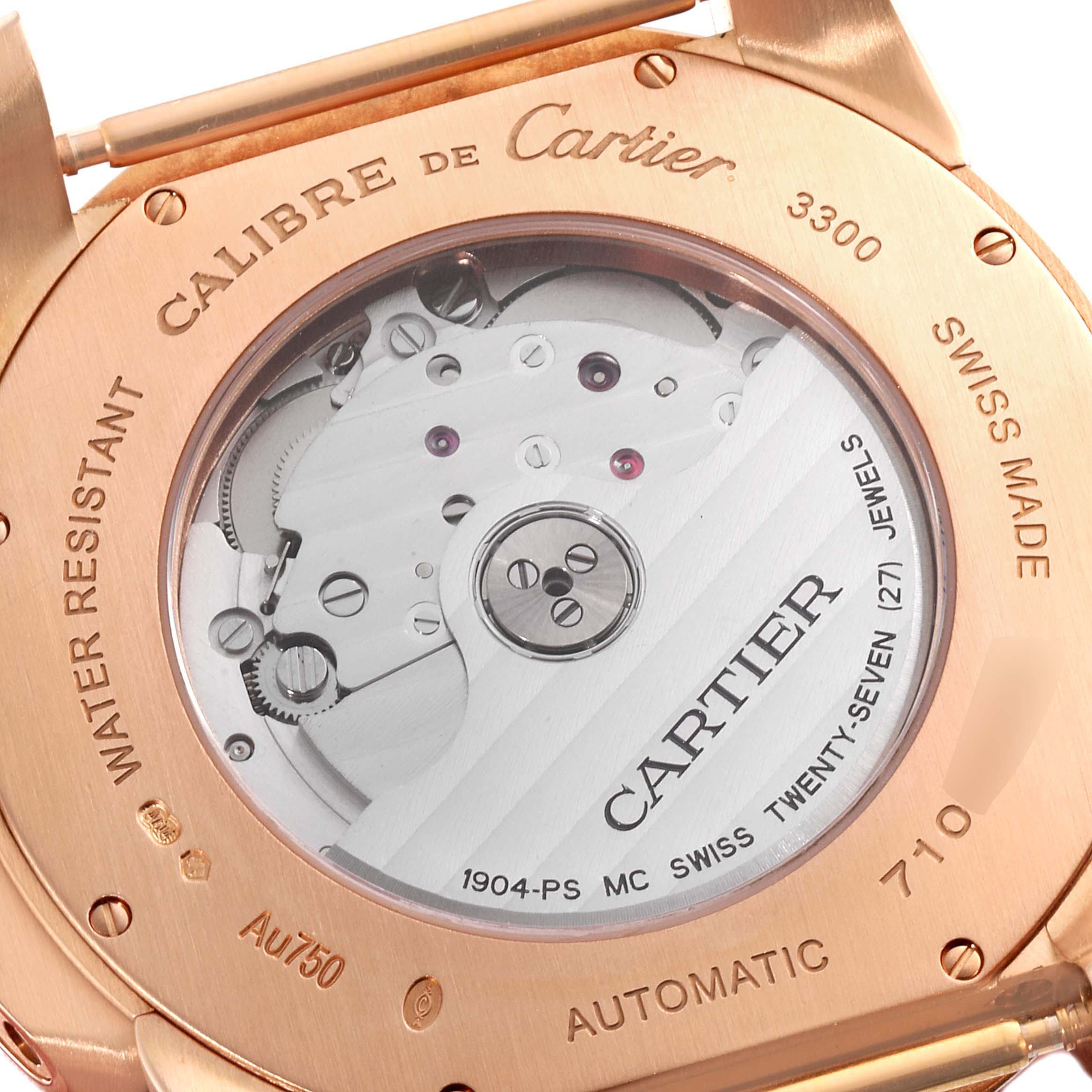 The image shows the back view of the Calibre de Cartier watch, highlighting the movement inside its case.