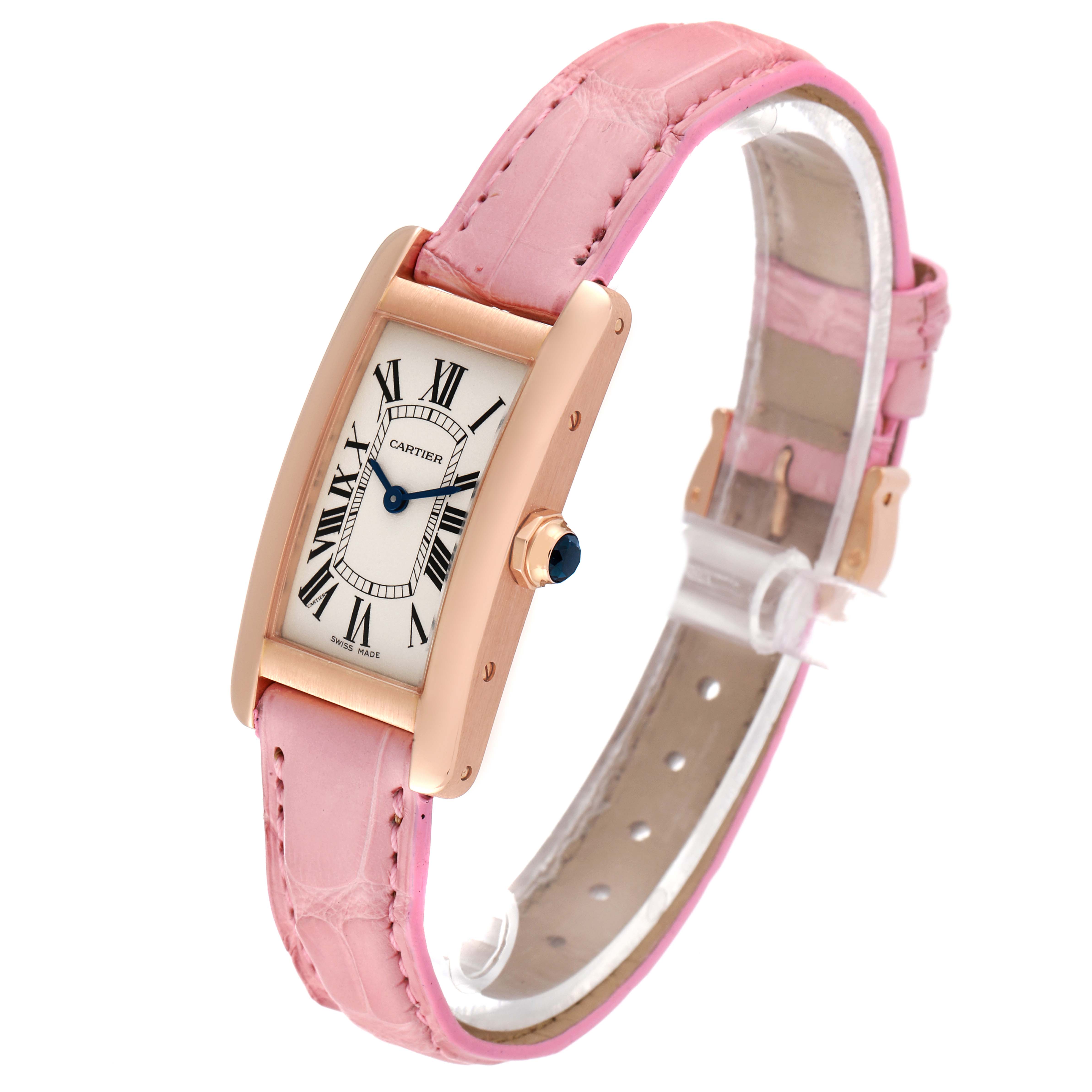 The Cartier Tank Americaine W2607456 Women's Rose Gold Silver Dial W2607456 Women's Rose Gold Silver Dial watch is shown at a slight angle, highlighting its pink leather strap and rectangular face with Roman numerals.