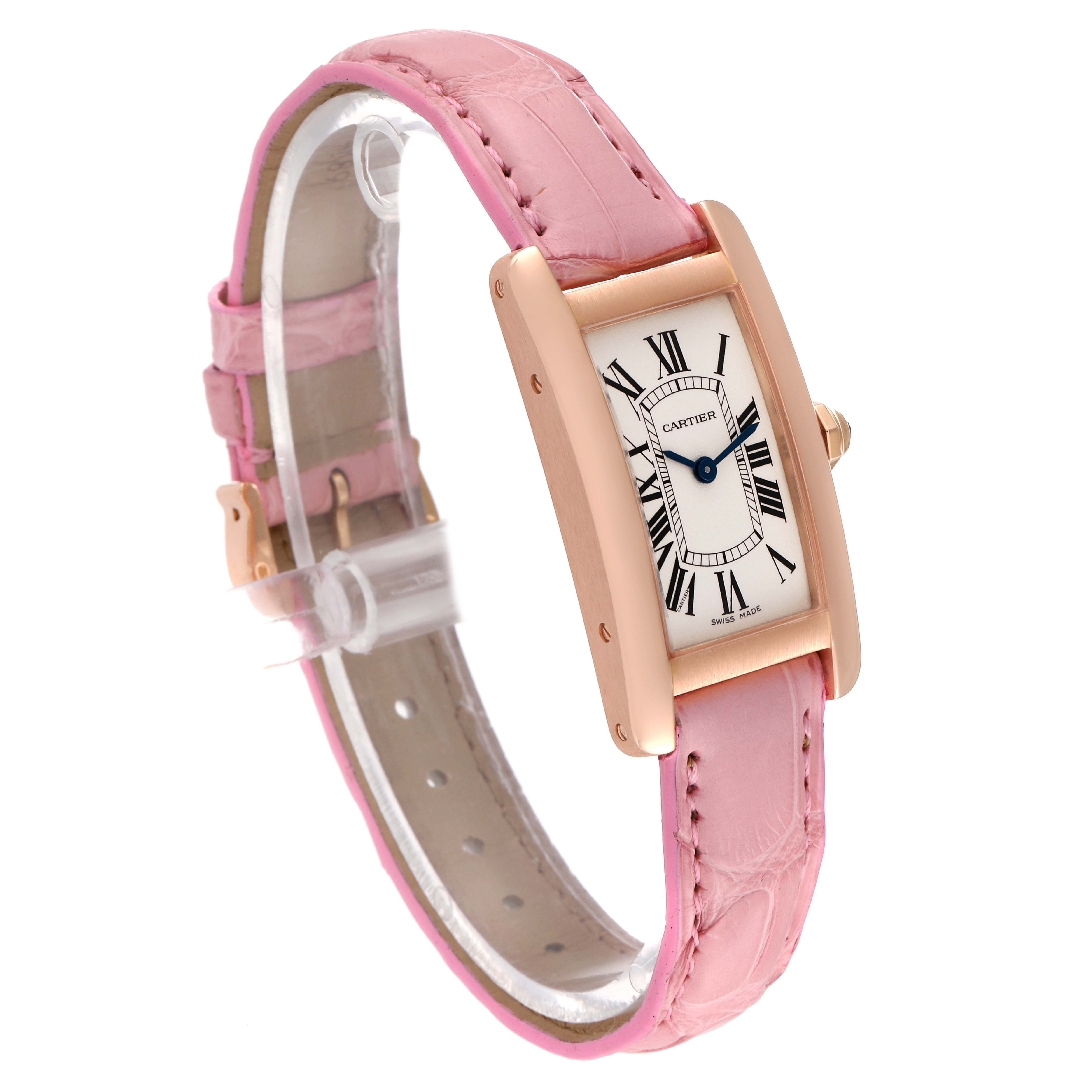 The image shows a Cartier Tank Americaine W2607456 Women's Rose Gold Silver Dial W2607456 Women's Rose Gold Silver Dial model watch at a slight angle, highlighting its pink strap and rectangular face with Roman numerals.