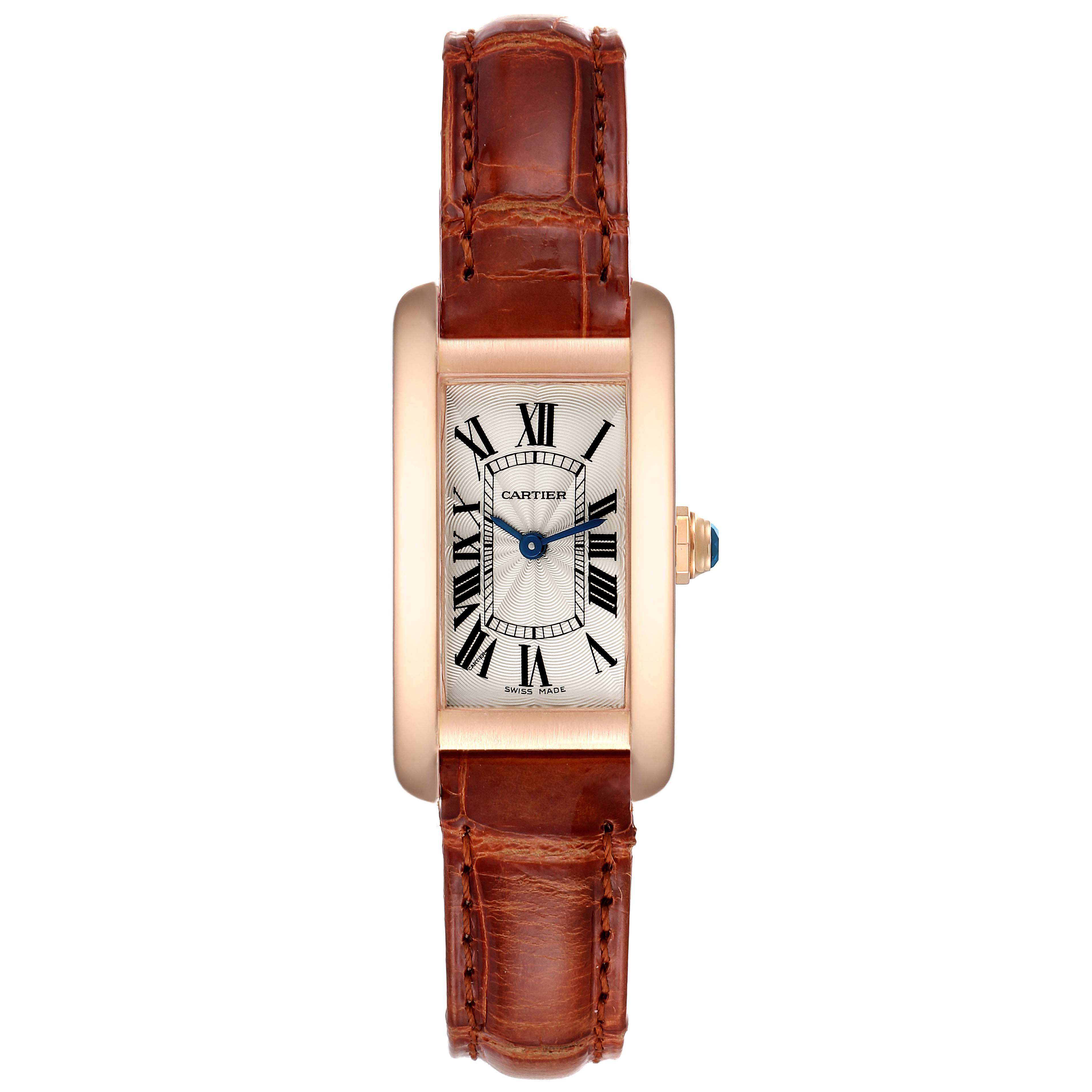 The image shows a front view of the Cartier Tank Americaine W2607456 Women's Rose Gold Silver Dial W2607456 Women's Rose Gold Silver Dial watch, highlighting its rectangular dial, Roman numerals, and brown leather strap.