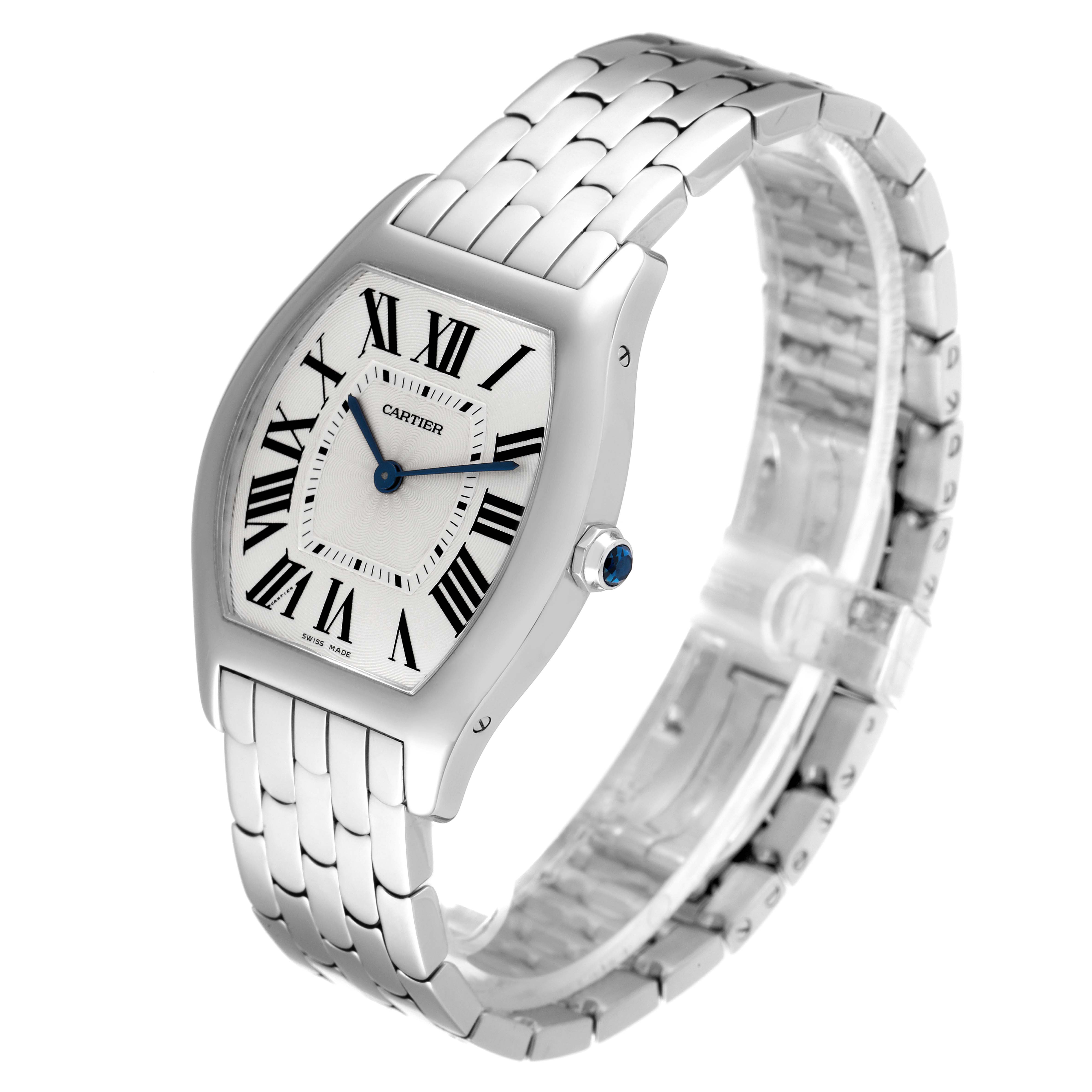 The image shows a Cartier Tortue 3701 Women's White Gold Silver Dial 3701 Women's White Gold Silver Dial watch angled to highlight its face and bracelet band, with its crown and blue cabochon visible.