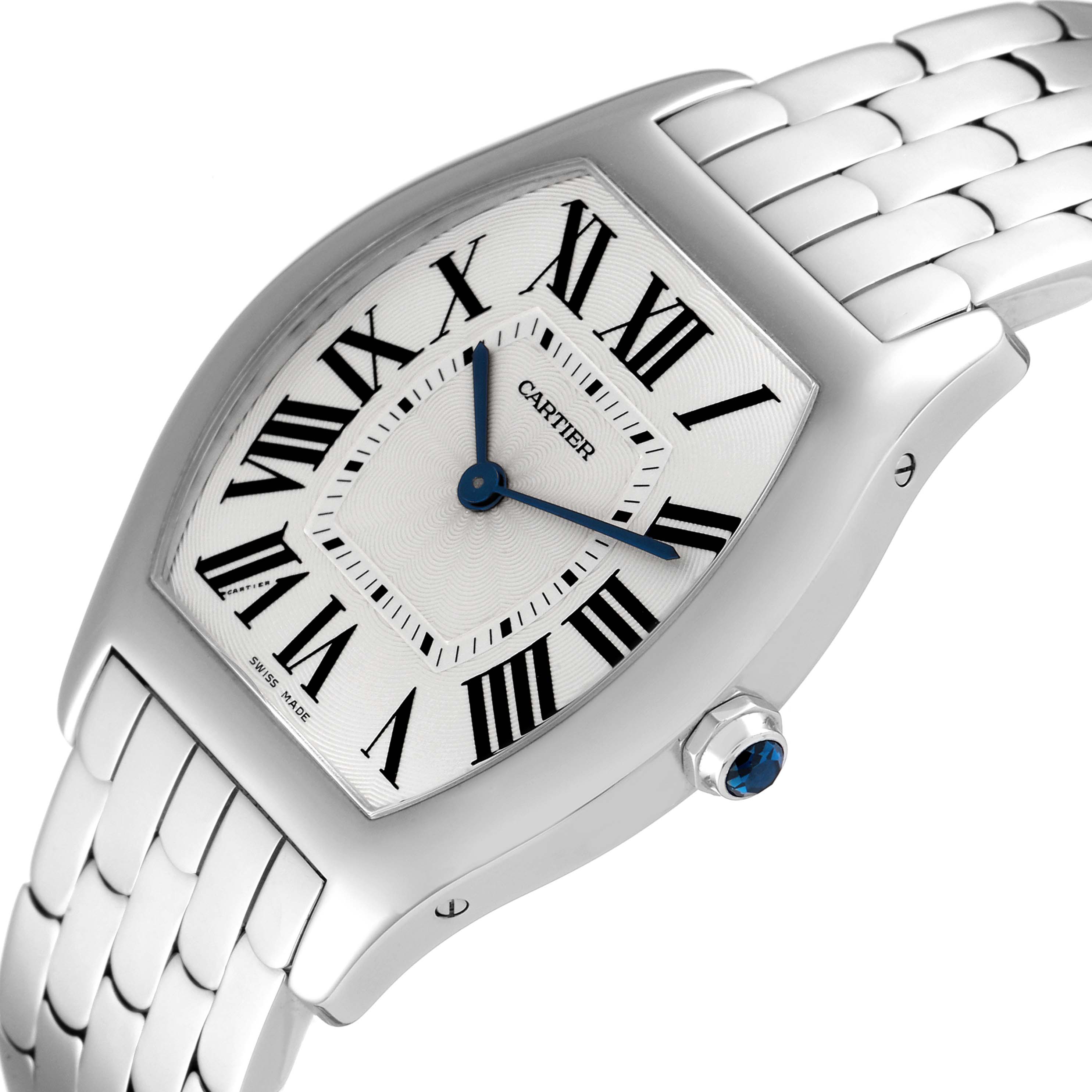 This image shows a tilted top view of the Cartier Tortue 3701 Women's White Gold Silver Dial 3701 Women's White Gold Silver Dial watch, displaying its face, Roman numerals, and metallic bracelet.