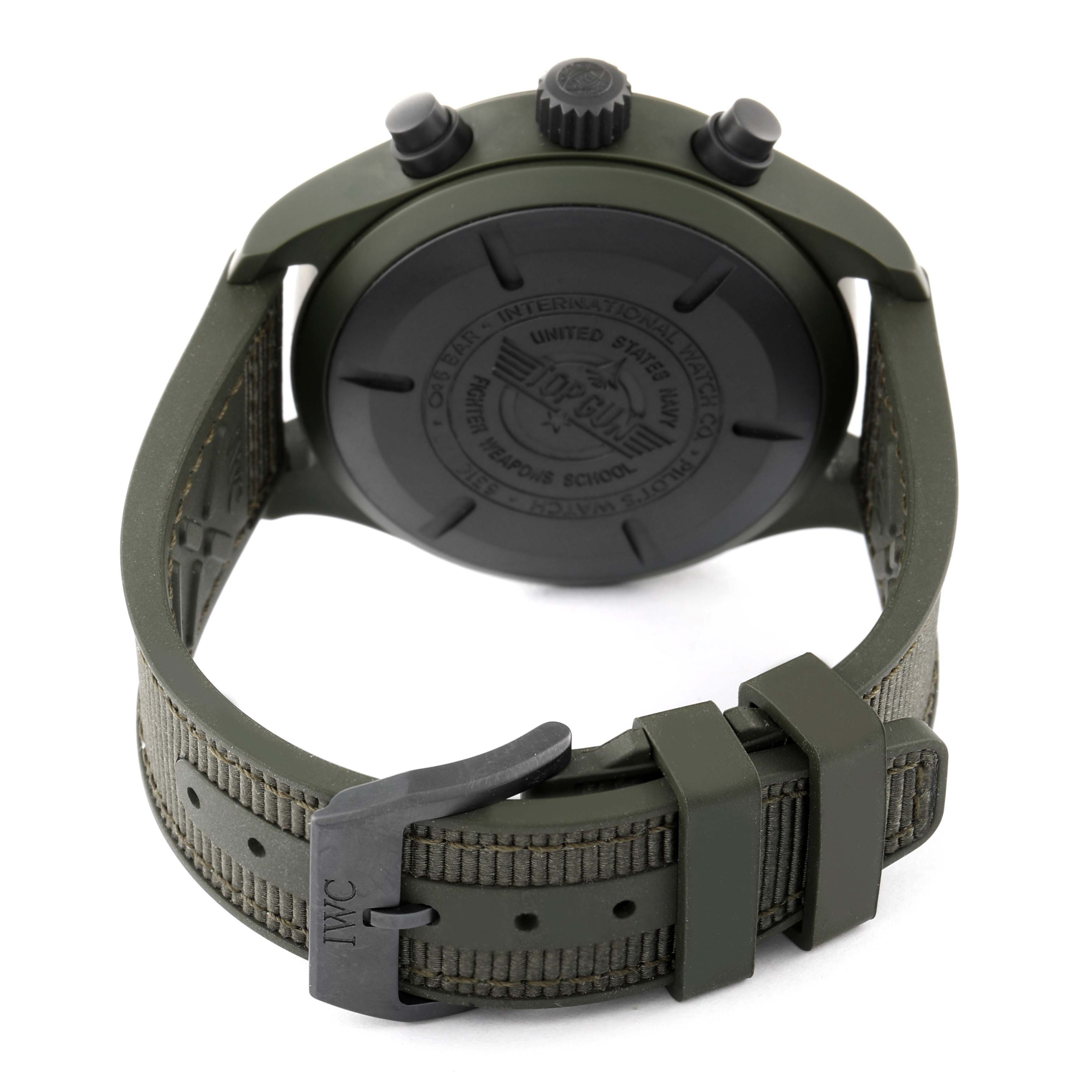 The image shows the back view of an IWC Pilot IW389106 Men's Ceramic Green Dial IW389106 Men's Ceramic Green Dial model watch, highlighting its black case, crown, pushers, and green strap with a buckle.