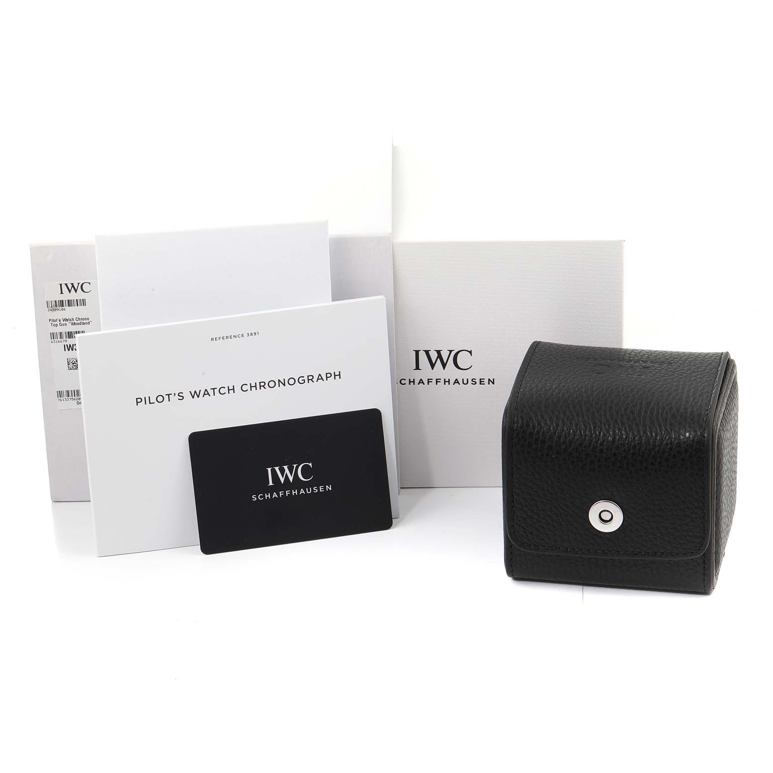 The image shows the packaging and accessories of the IWC Pilot IW389106 Men's Ceramic Green Dial IW389106 Men's Ceramic Green Dial's Watch, including manuals, warranty card, and a black leather case.