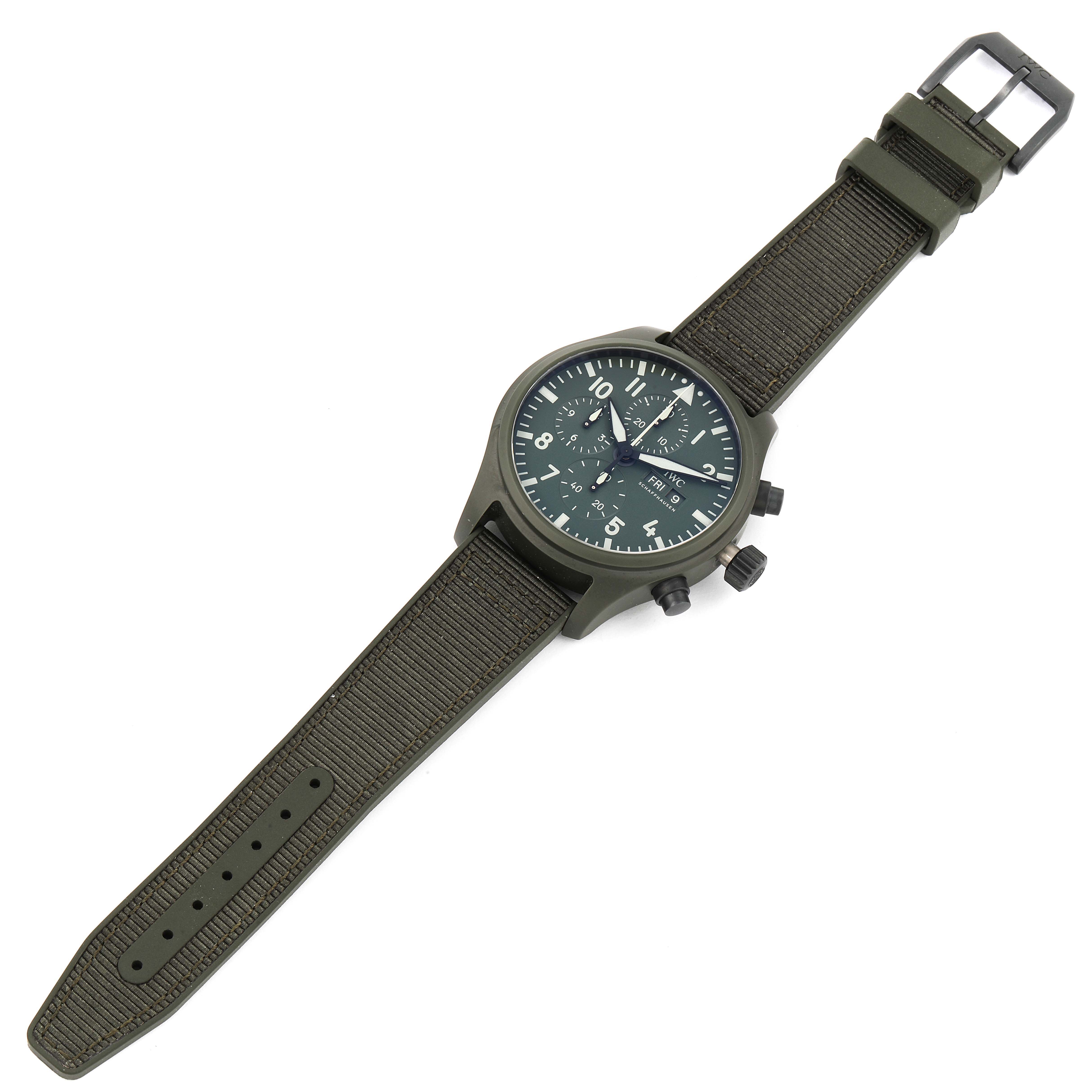This image shows a top view of an IWC Pilot IW389106 Men's Ceramic Green Dial IW389106 Men's Ceramic Green Dial watch, including the dial, case, strap, buckle, and buttons.