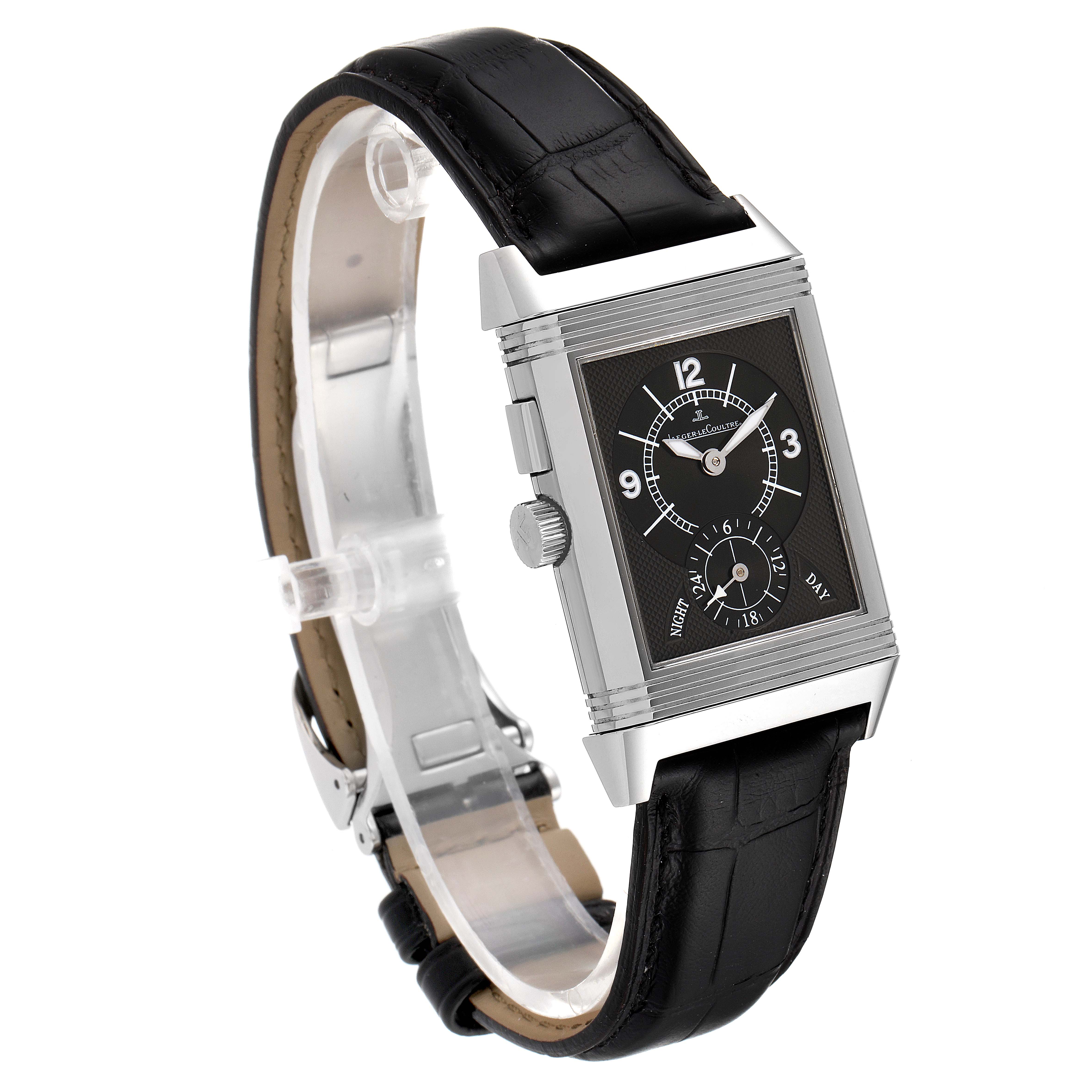 The Reverso model by Jaeger LeCoultre is shown at a three-quarter angle, highlighting the black leather strap and black dial.