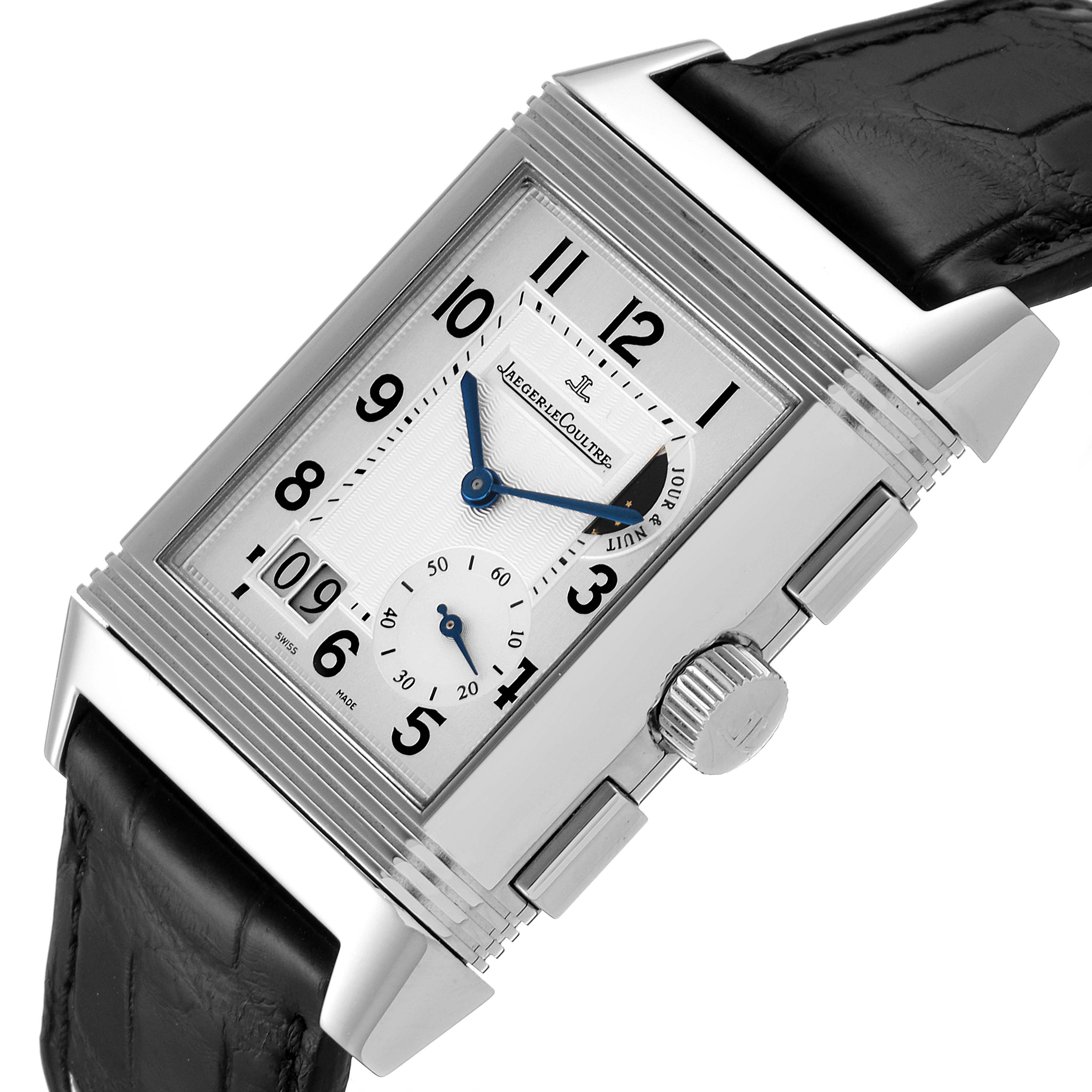 The image shows the Jaeger LeCoultre Reverso Q3028420 Men's Stainless Steel Silver Dial Q3028420 Men's Stainless Steel Silver Dial watch at an angle highlighting its rectangular dial, crown, and leather strap.