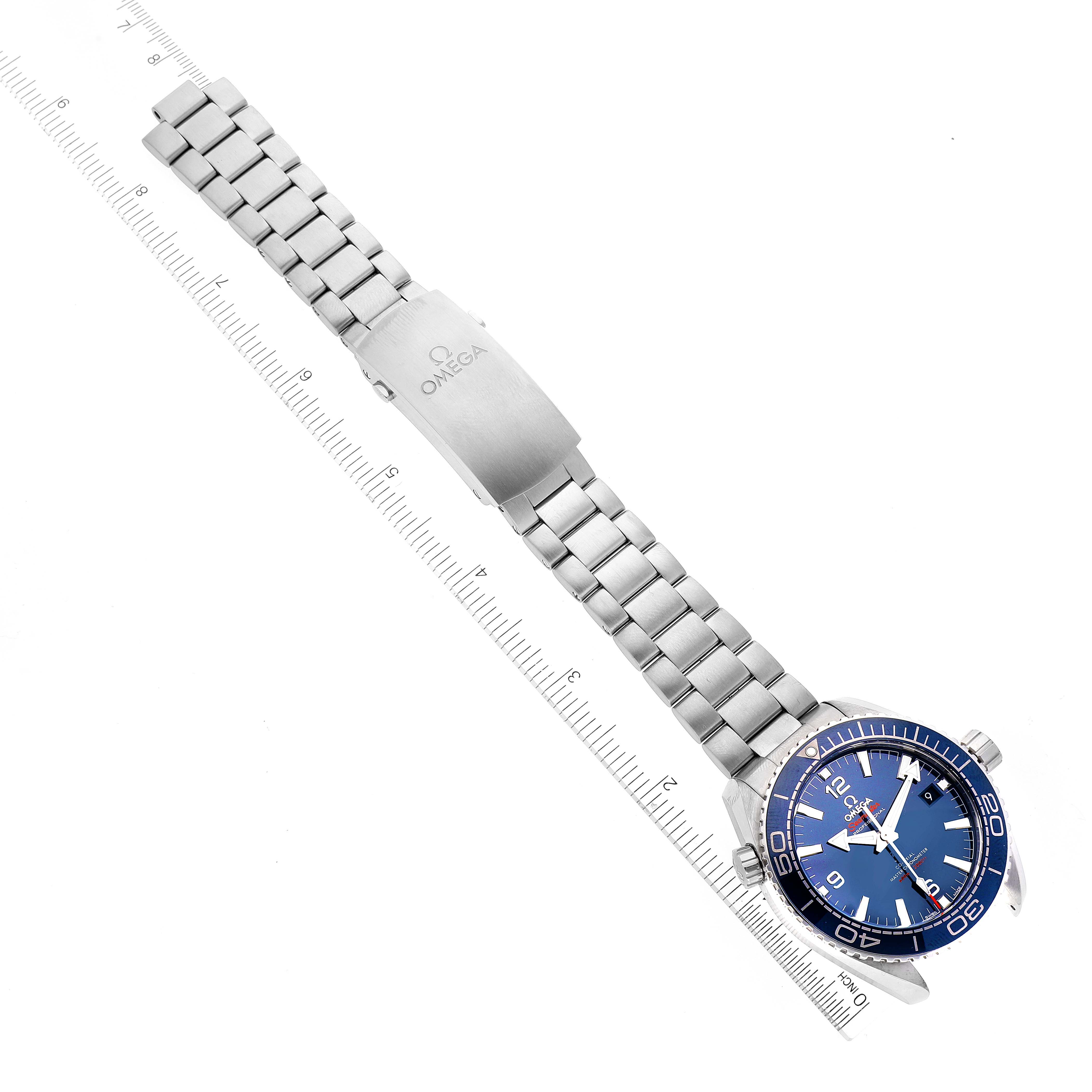 The image shows the Omega Planet Ocean 215.30.44.21.03.001 Men's Stainless Steel Blue Dial 215.30.44.21.03.001 Men's Stainless Steel Blue Dial watch at an angled top-down view, highlighting the bracelet, clasp, and the face of the watch.