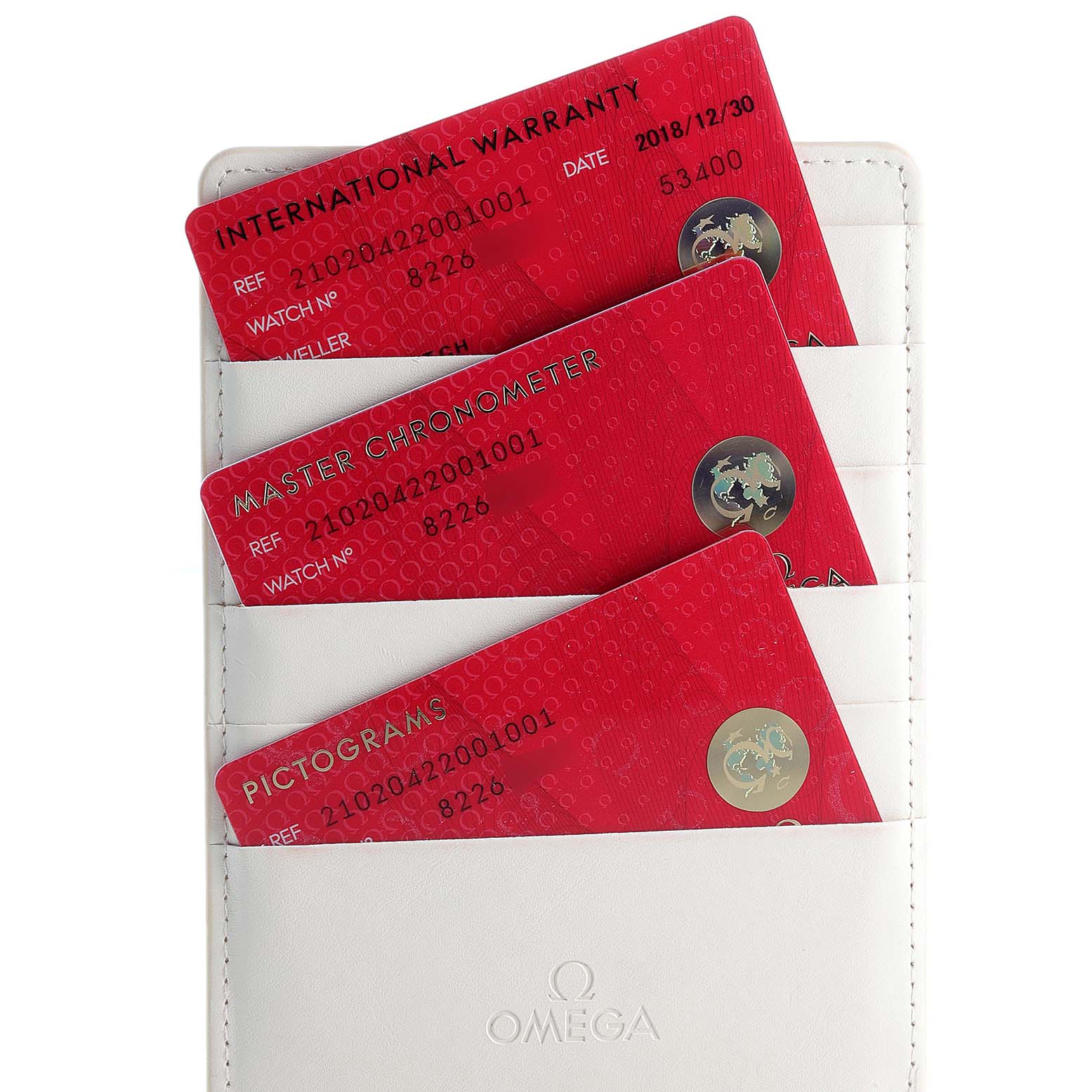 Image shows an Omega Seamaster 210.20.42.20.01.001 Men's Steel and Gold (two tone) Black Dial 210.20.42.20.01.001 Men's Steel and Gold (two tone) Black Dial watch's warranty cards, including International Warranty, Master Chronometer, and Pictograms, in a white cardholder.