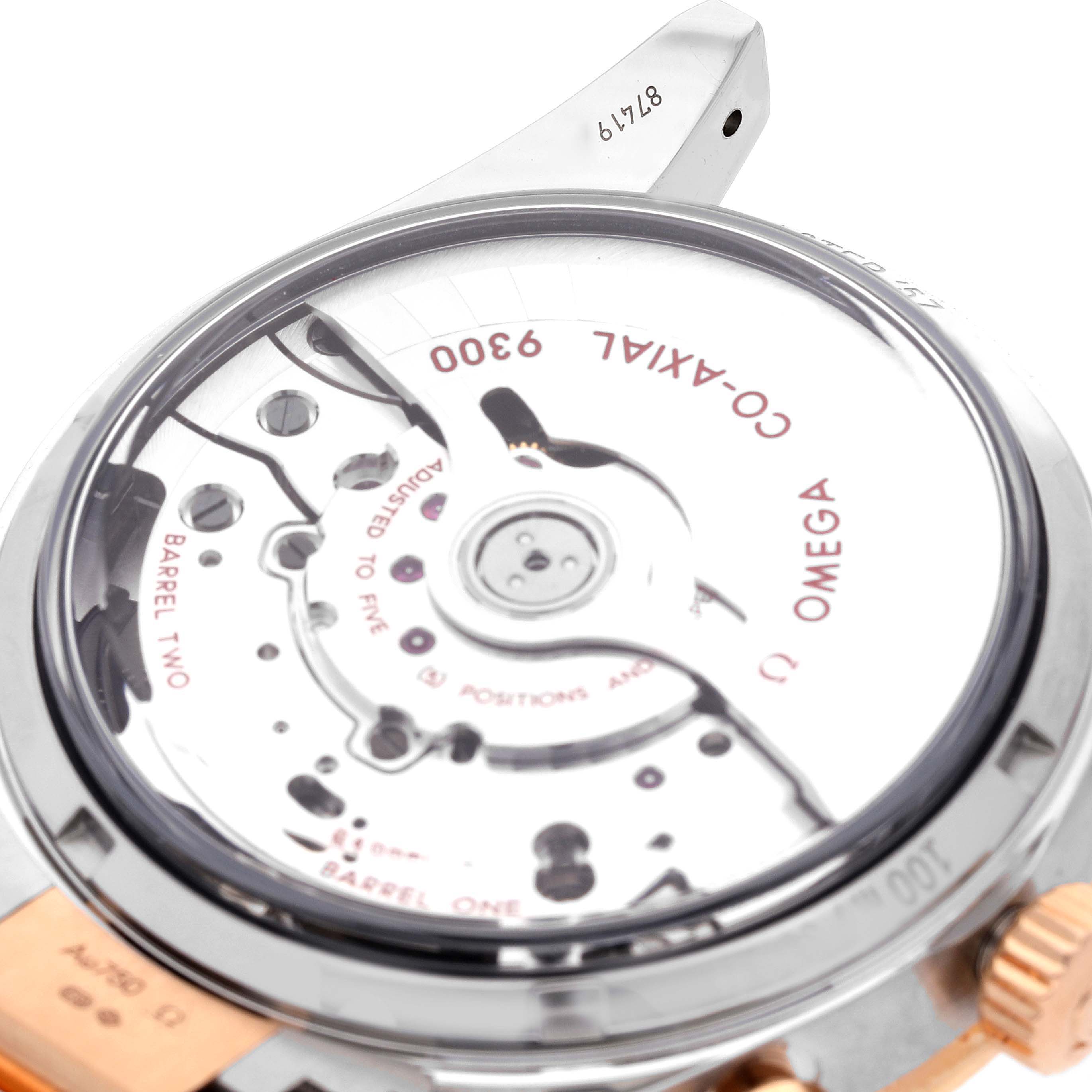 The image shows the back of an Omega Speedmaster 331.20.42.51.01.002 Men's Steel and Gold (two tone) Black Dial 331.20.42.51.01.002 Men's Steel and Gold (two tone) Black Dial watch, highlighting the movement and Co-Axial 9300 marking.