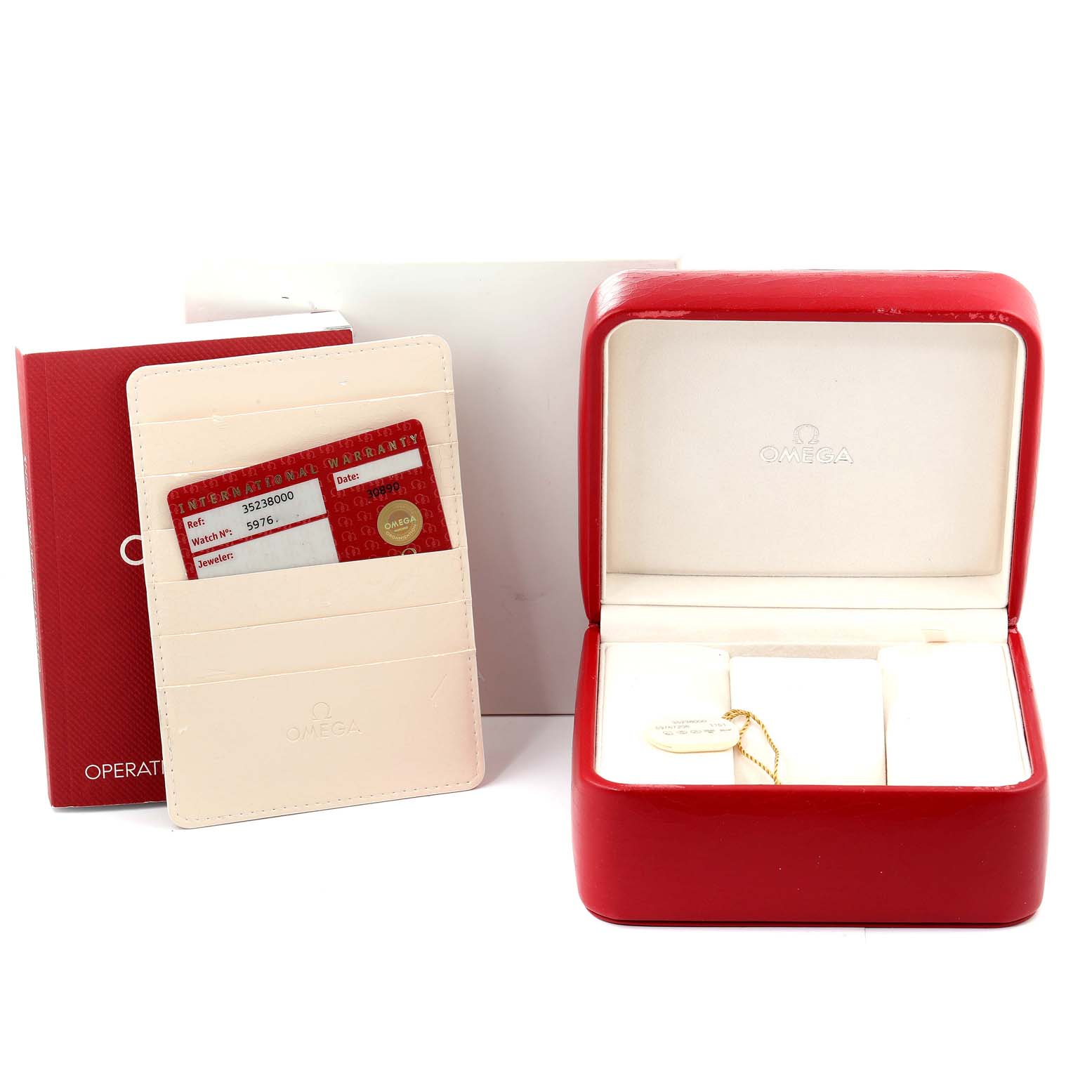 The image shows the watch box, warranty cards, and cardholder for the Omega Speedmaster 3523.80.00 Men
s Stainless Steel Blue Dial 3523.80.00 Men
s Stainless Steel Blue Dial model.