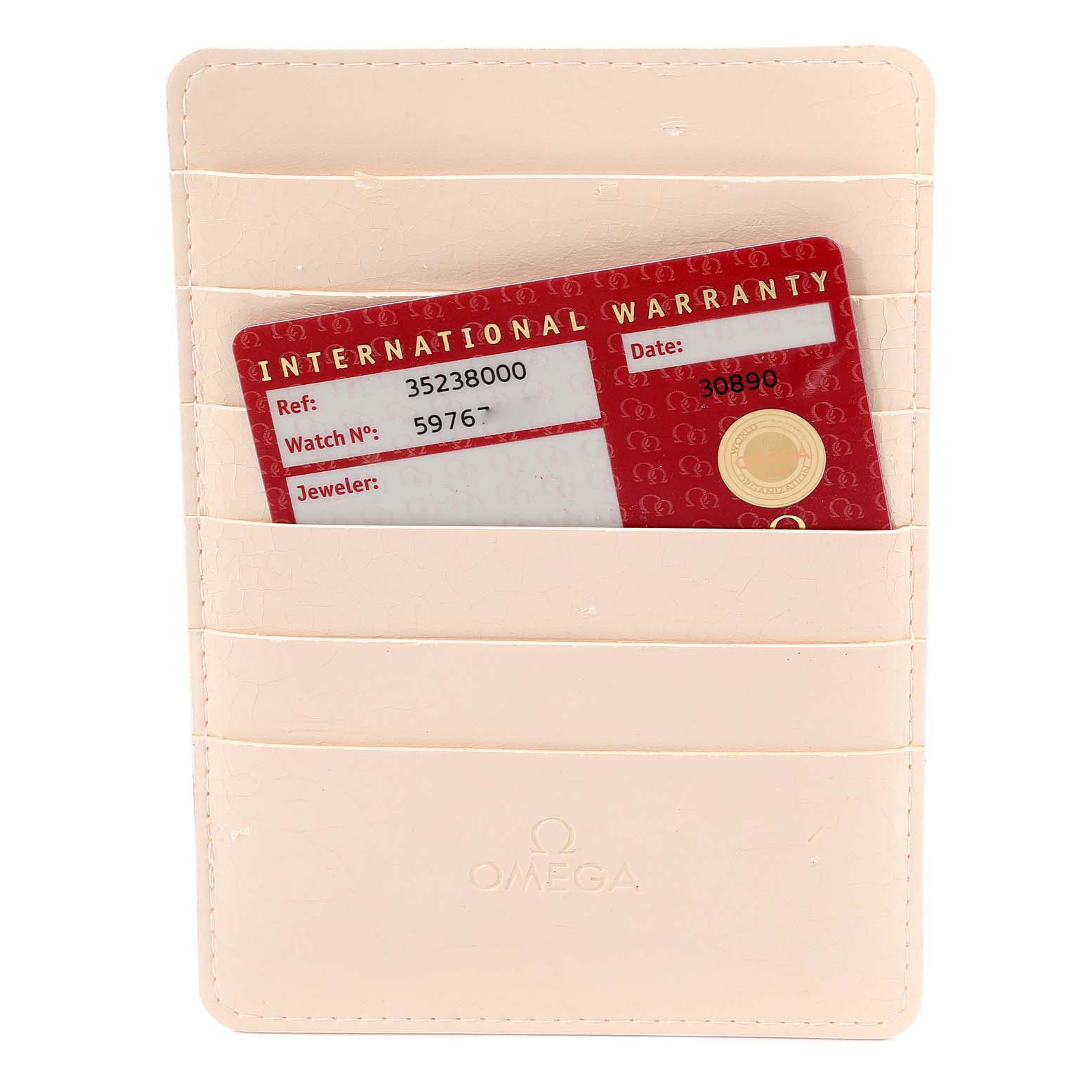 The image shows a beige Omega cardholder with a red international warranty card placed inside.