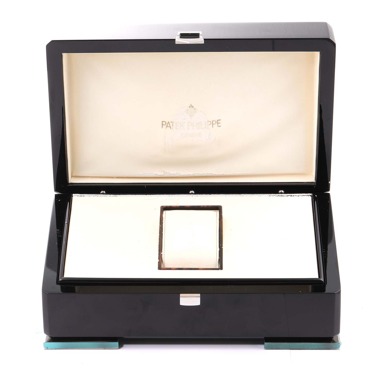 This image shows an open watch box for the Calatrava model by Patek Philippe, displaying the brand logo inside the lid.