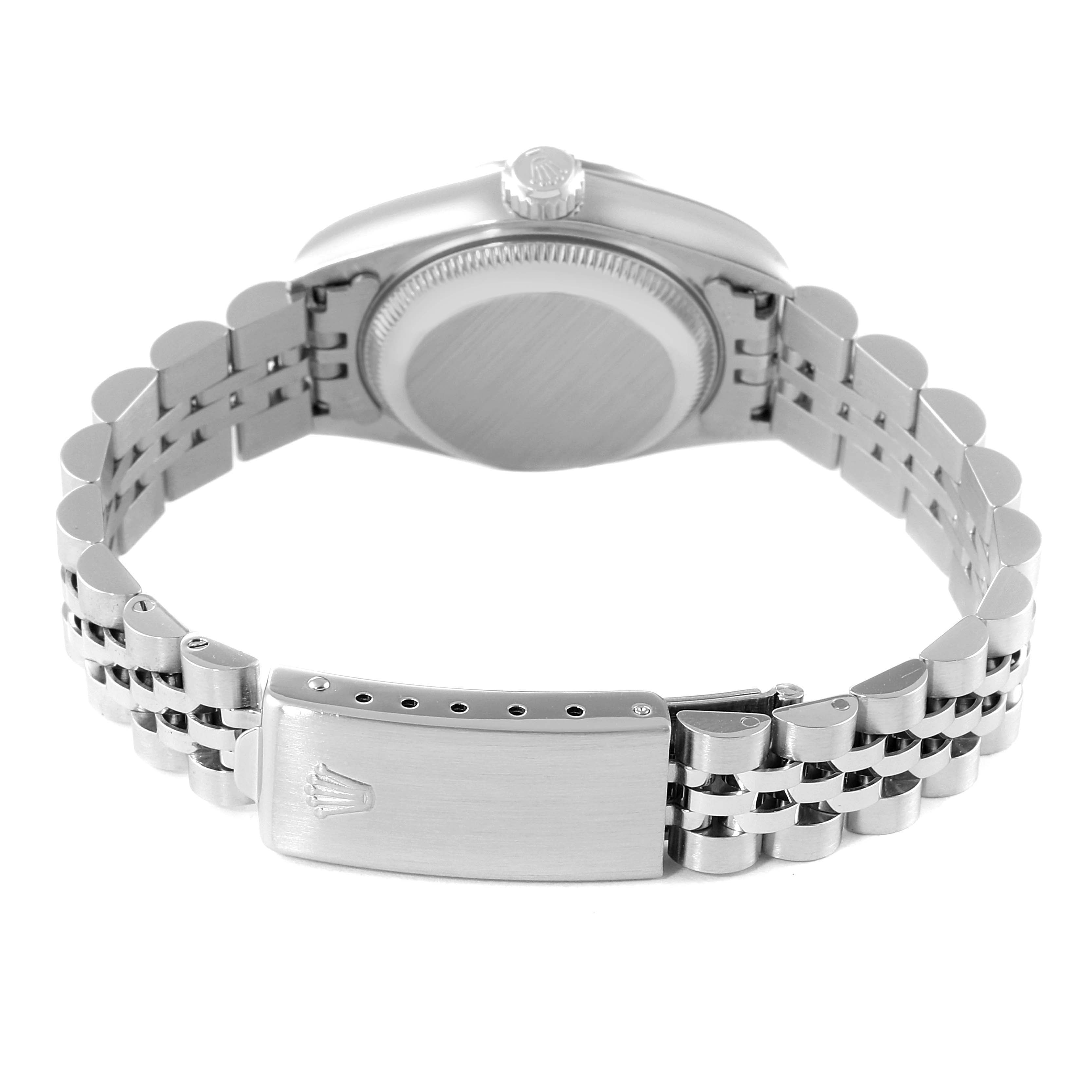 The image shows the back view of a Rolex Date 79240 Women's Stainless Steel Blue Dial 79240 Women's Stainless Steel Blue Dial model watch, focusing on the case back and the stainless steel bracelet clasp.