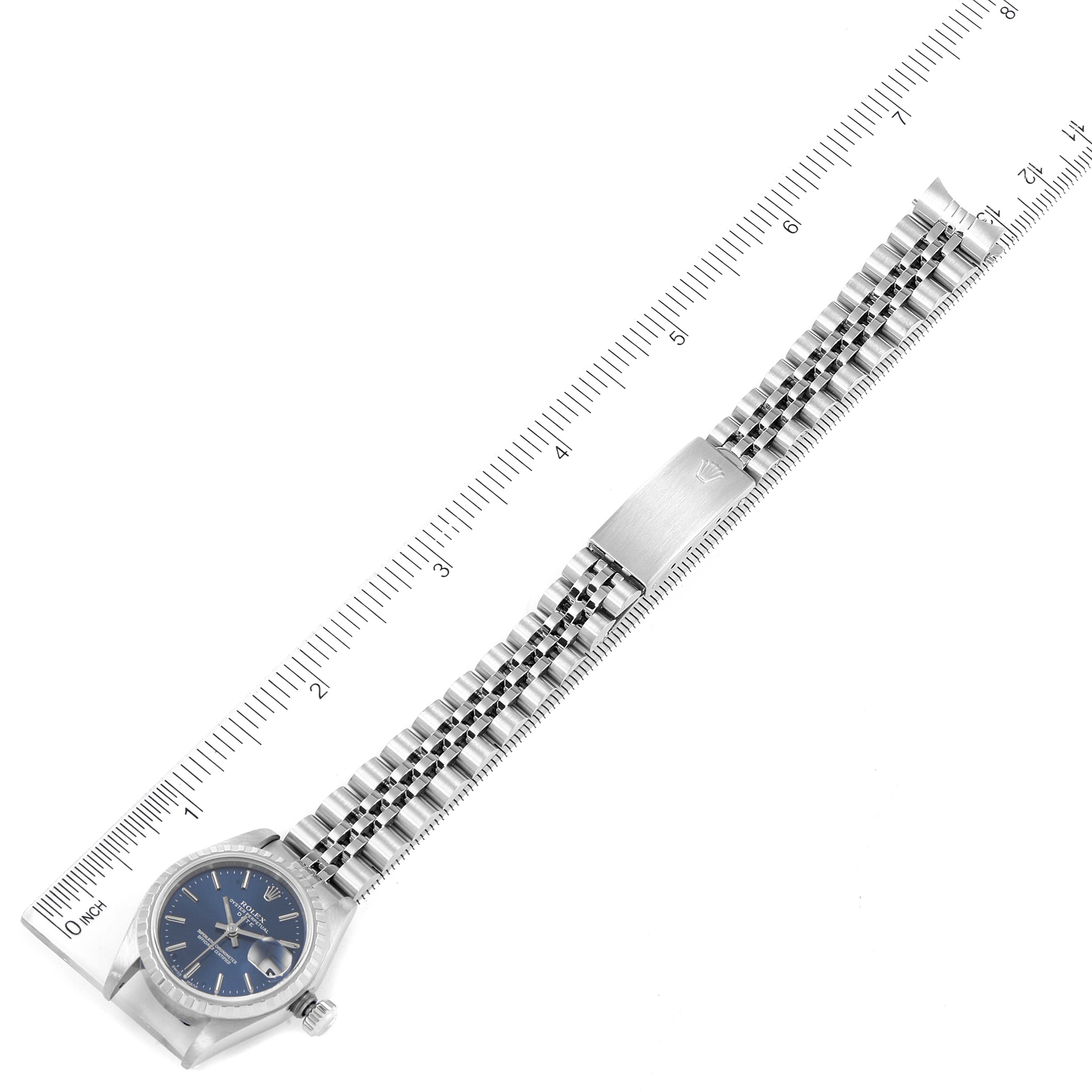 The image shows a top view of a Rolex Date 79240 Women's Stainless Steel Blue Dial 79240 Women's Stainless Steel Blue Dial model watch, including the face and band, aligned with a measuring ruler.